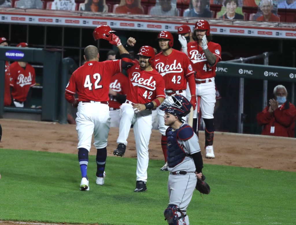 Cincinnati Reds first baseman Joey Votto (left) reacts with Cincinnati Reds shortstop Eugenio Suarez (right) after hitting a two-run home run against the Cleveland Indians during the third inning at Great American Ball Park