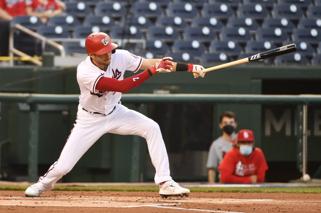 Washington Nationals shortstop Trea Turner (7) hits a single against the St. Louis Cardinals during the first inning at Nationals Park