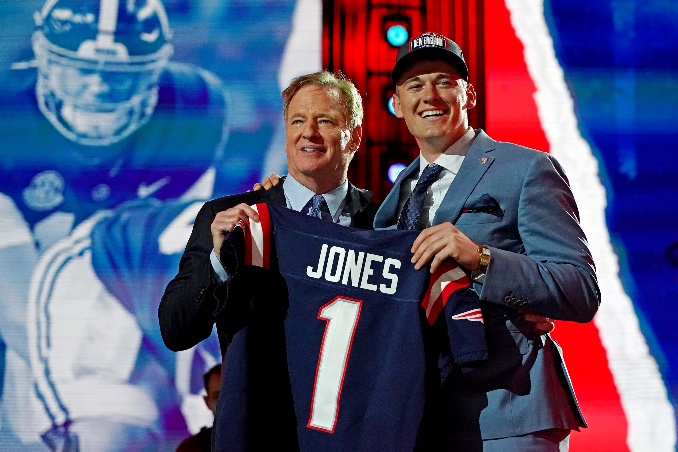 Mac Jones (Alabama) with NFL commissioner Roger Goodell after being selected by the New England Patriots as the number 15 overall pick in the first round of the 2021 NFL Draft at First Energy Stadium.
