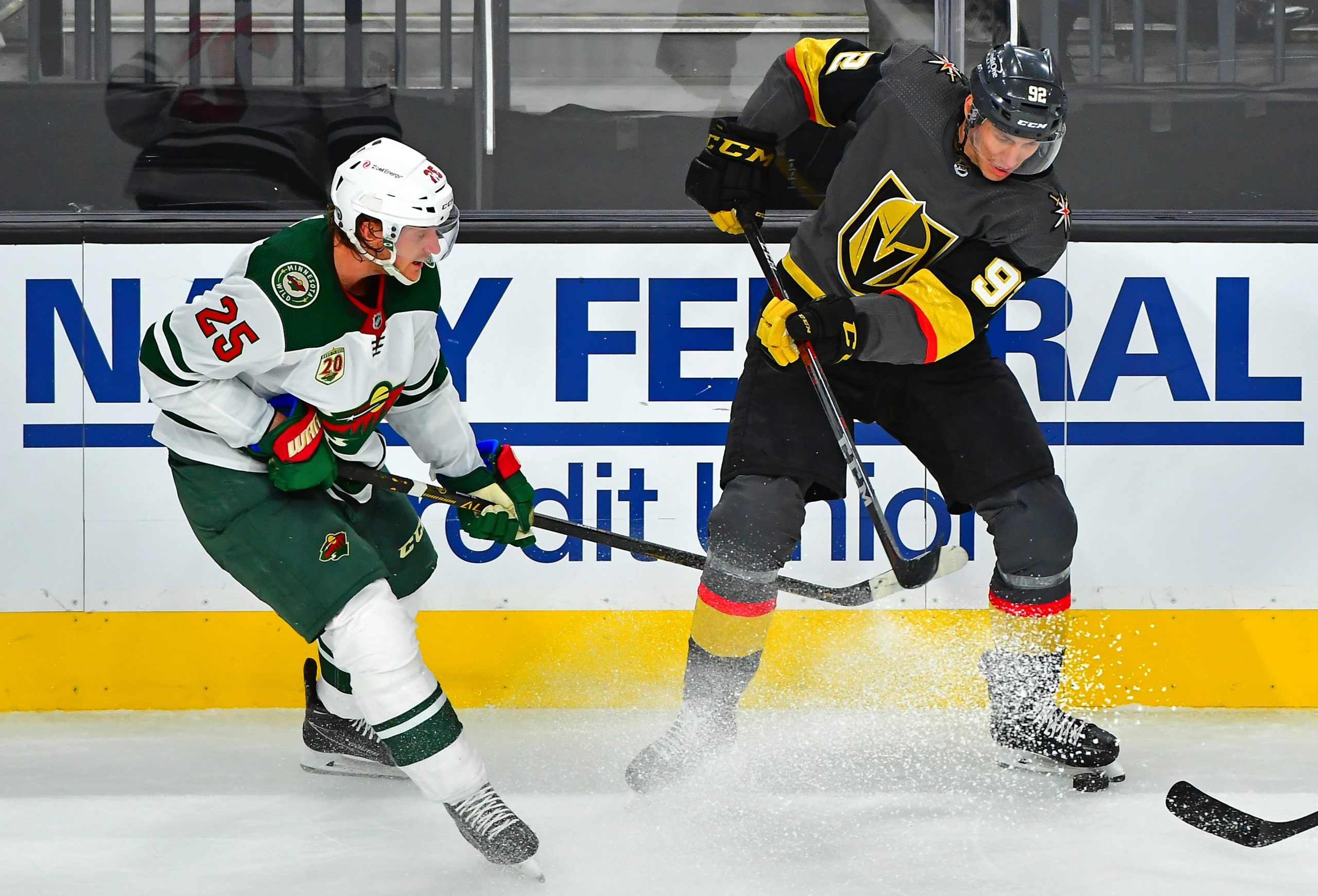 Vegas Golden Knights left wing Tomas Nosek (92) stops the puck with a skate as he intercepts it from Minnesota Wild defenseman Jonas Brodin (25)