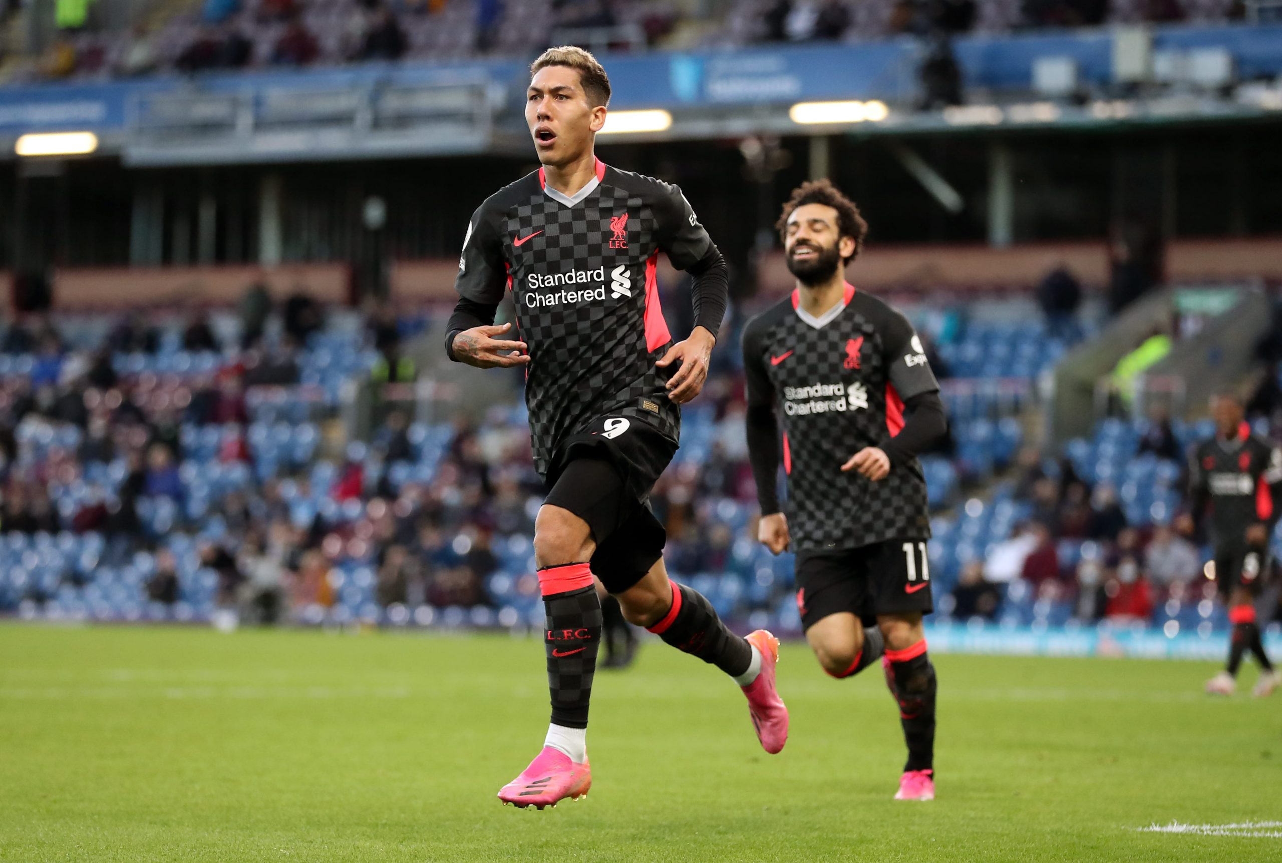 Liverpool's Roberto Firmino celebrates scoring the opening goal during the Premier League match at Turf Moor, Burnley. Picture date: Wednesday May 19, 2021.
