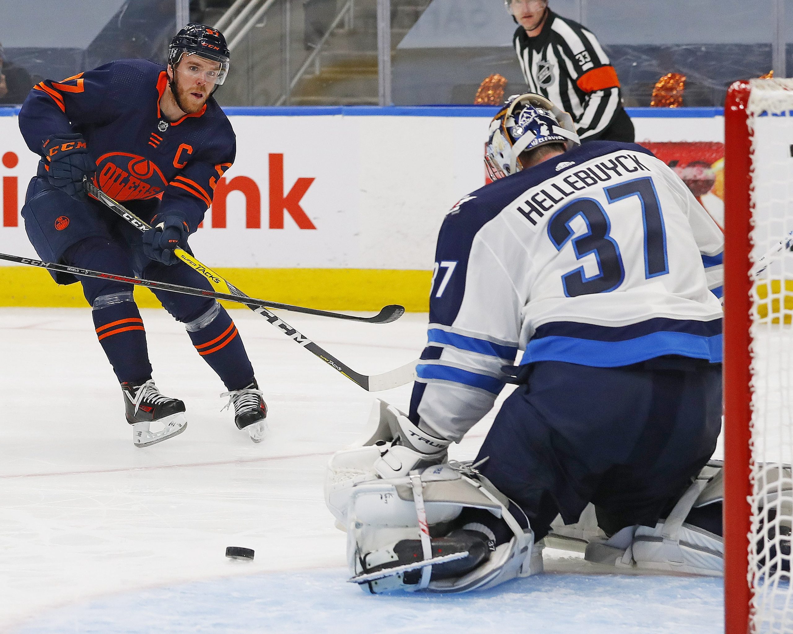 Edmonton Oilers forward Connor McDavid (97) puts a shot just wide of Winnipeg Jets goaltender Connor Hellebuyck (37)