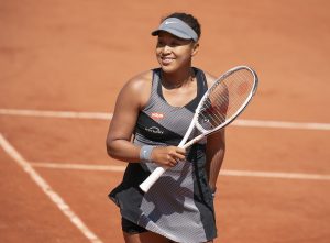 Naomi Osaka beat Patricia Tig in her first-round French Open match before withdrawing from the event