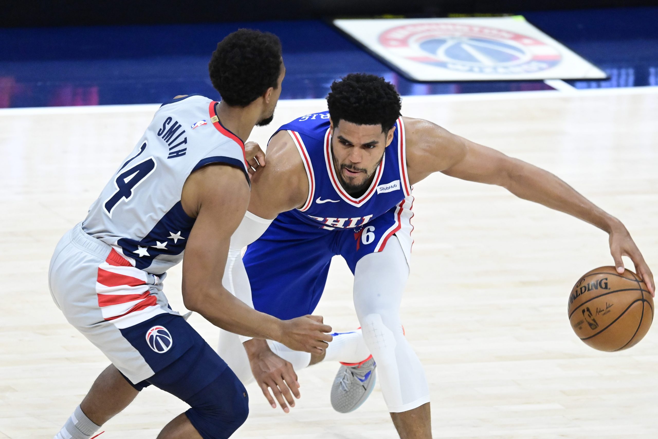 Philadelphia 76ers forward Tobias Harris (12) dribbles as Washington Wizards guard Ish Smith (14) defense in the second half during game four in the first round of the 2021 NBA Playoffs.
