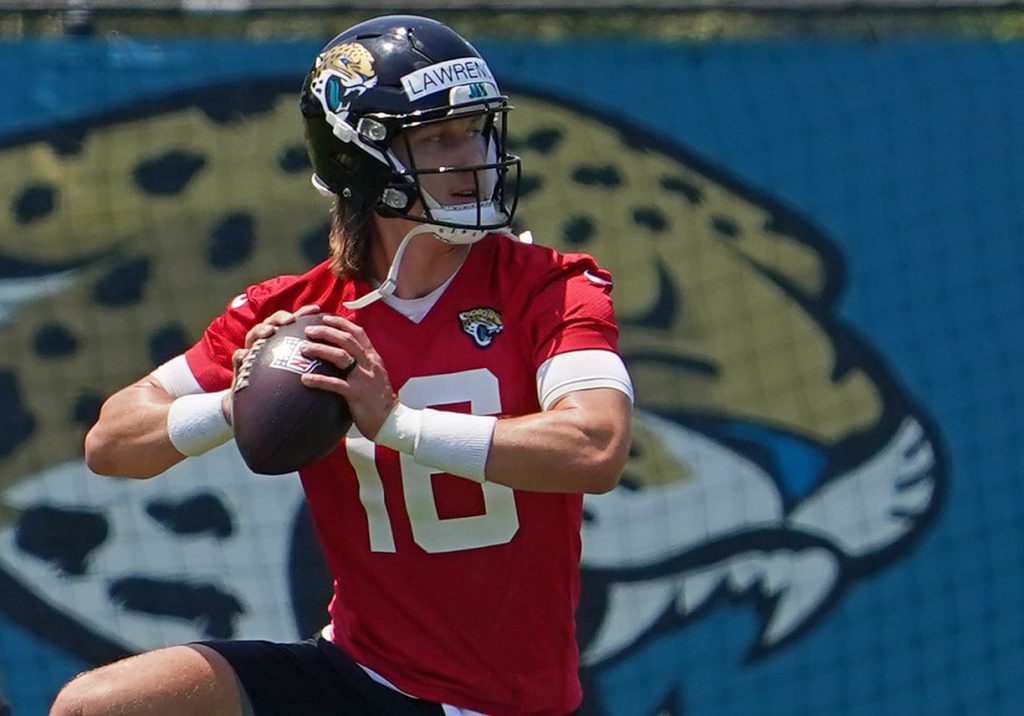 Jacksonville Jaguars quarterback Trevor Lawrence (16) participates in drills during OTA at the Dream Finders Homes Practice Complex.