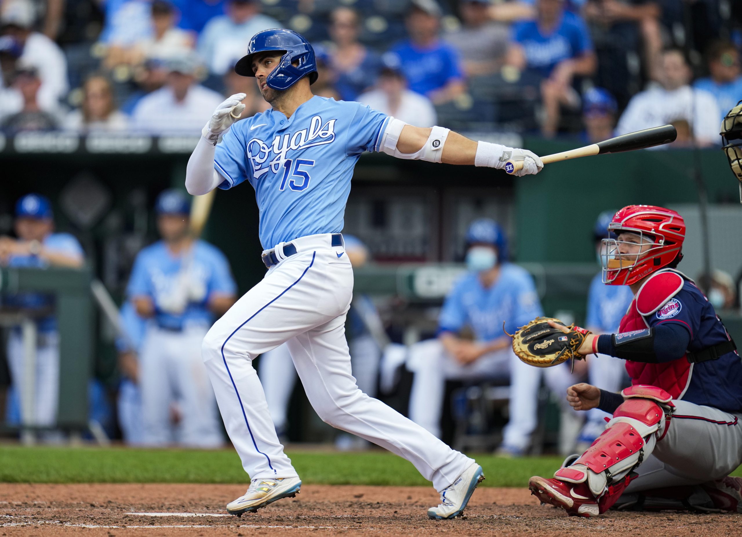 Kansas City Royals second baseman Whit Merrifield (15) hits a double against the Minnesota Twins during the ninth inning at Kauffman Stadium.
