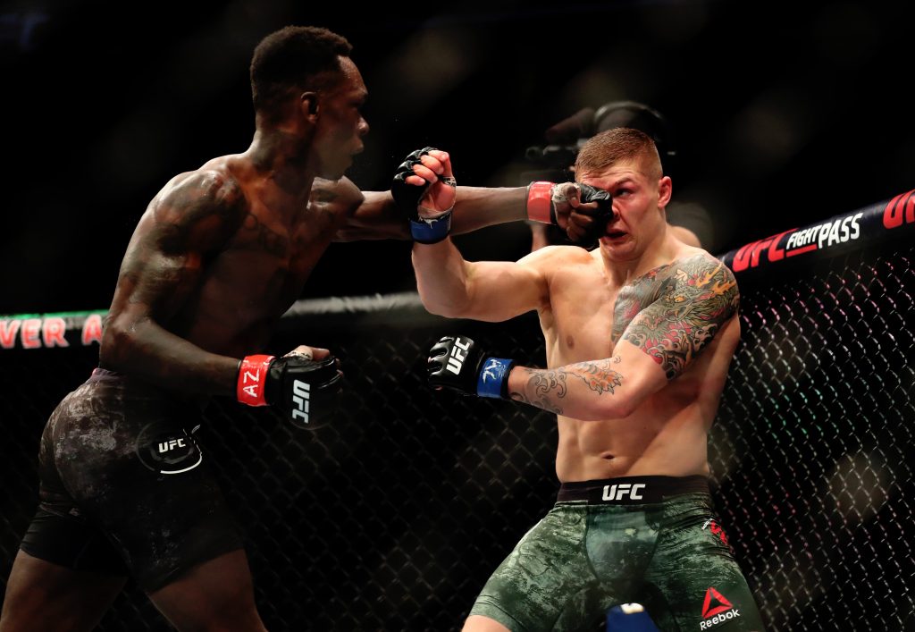 Israel Adesanya (red gloves) fights against Marvin Vettori (blue gloves) during UFC Fight Night at Gila River Arena.