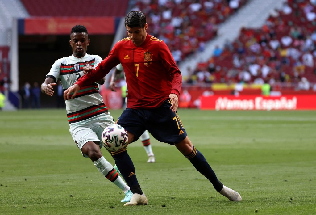 Spain's striker Alvaro Morata (R) vies for the ball against Portugal's defender Nelson Semedo (L) during the international friendly soccer match between Spain and Portugal at Wanda Metropolitano stadium in Madrid, Spain