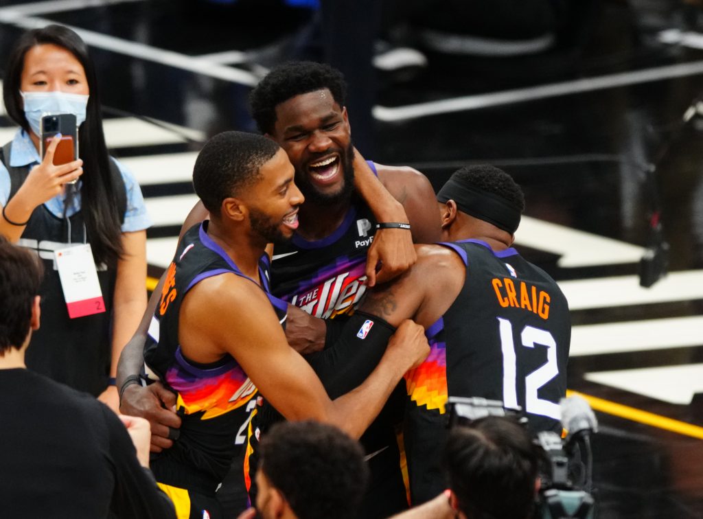 Phoenix Suns center Deandre Ayton (22) celebrates with teammates after scoring the game winning shot against the Los Angeles Clippers in the second half during game two of the Western Conference Finals for the 2021 NBA Playoffs at Phoenix Suns Arena