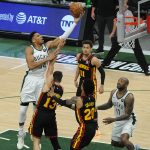 Milwaukee Bucks forward Giannis Antetokounmpo (34) shoots the ball over Atlanta Hawks guard Bogdan Bogdanovic (13) in the first quarter during game two of the Eastern Conference Finals for the 2021 NBA Playoffs at Fiserv Forum