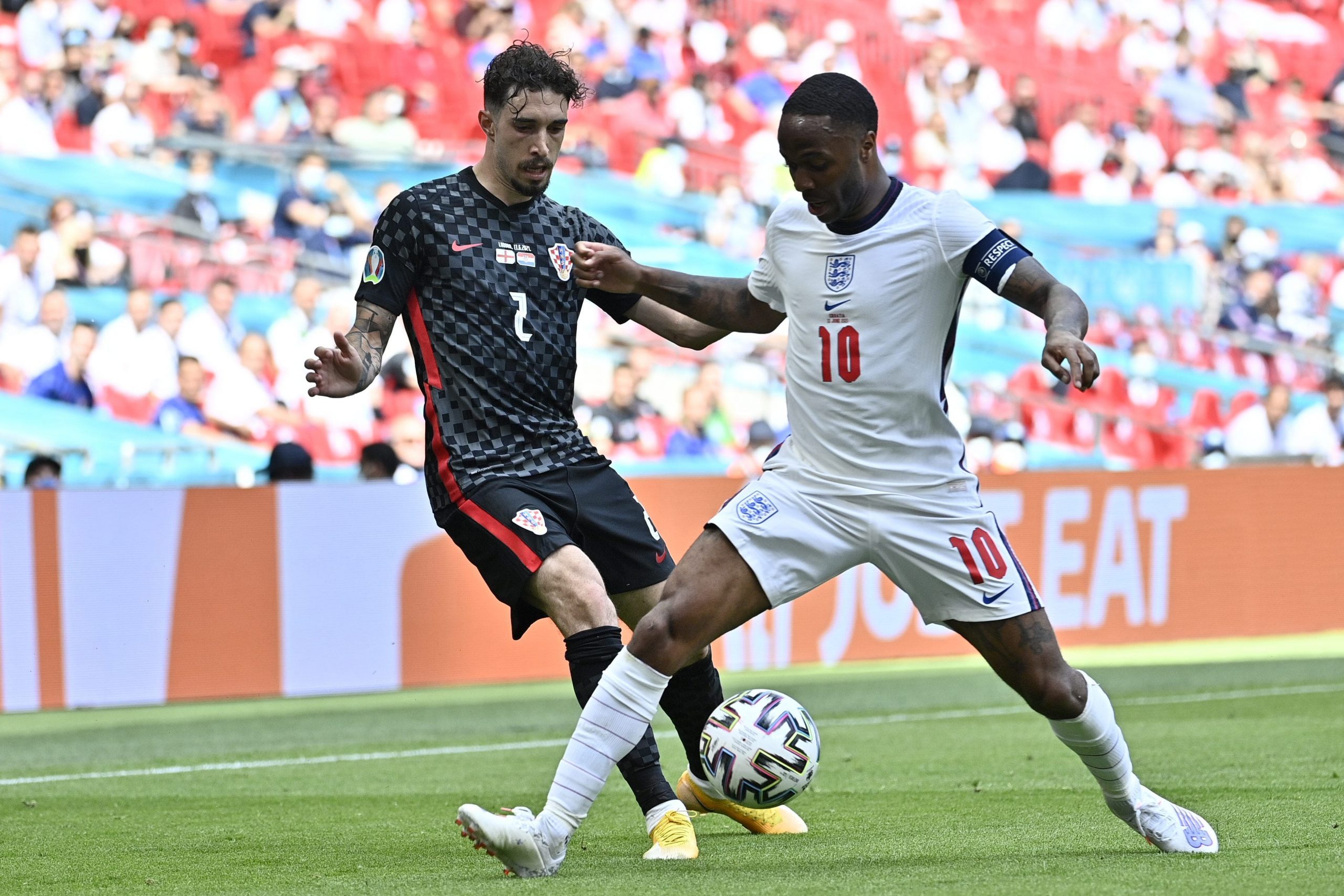 England's Raheem Sterling (right)