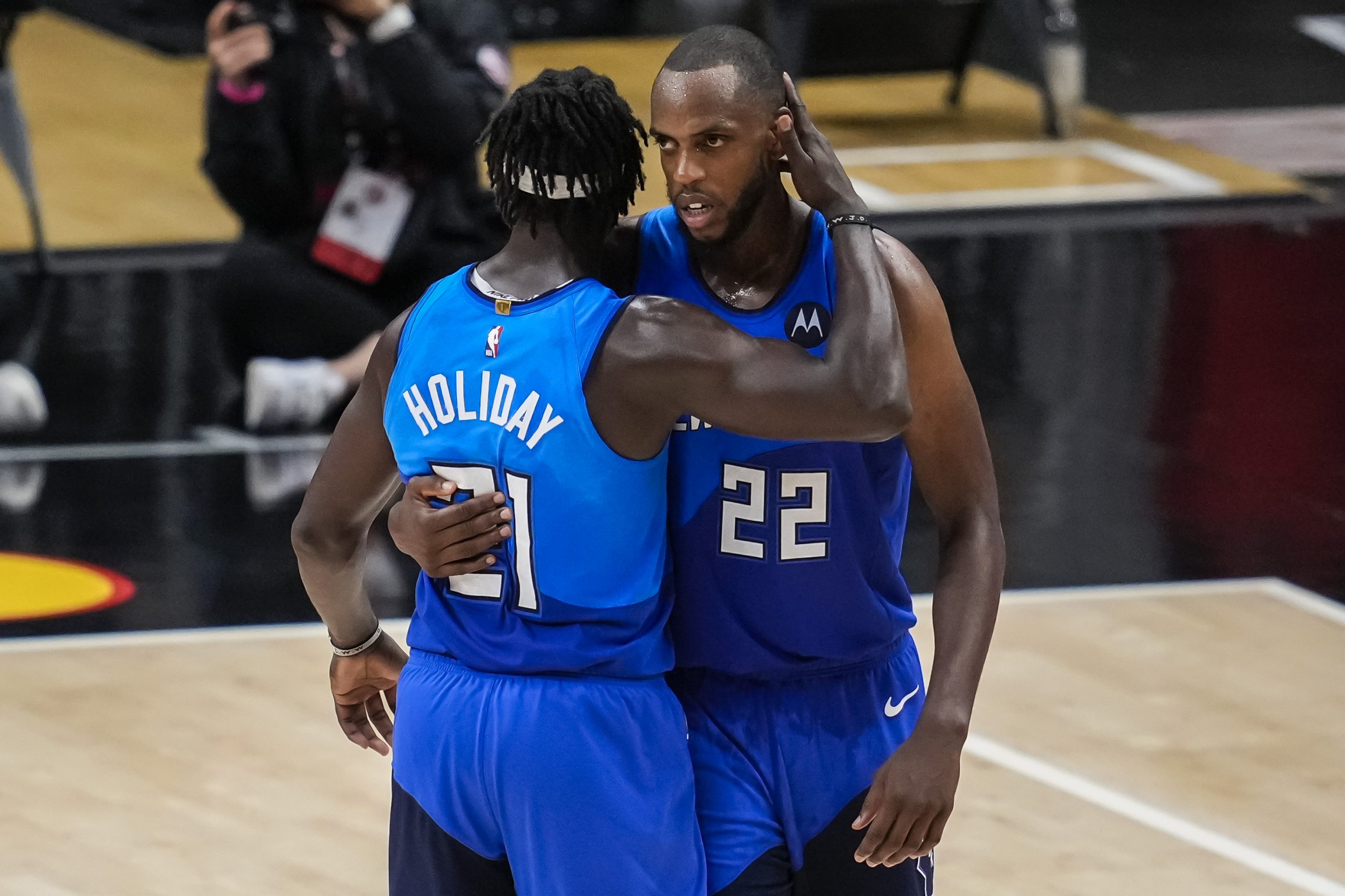 Milwaukee Bucks forward Khris Middleton (22) reacts with guard Jrue Holiday (21) after the Bucks defeated the Atlanta Hawks in game three of the Eastern Conference Finals for the 2021 NBA Playoffs at State Farm Arena.