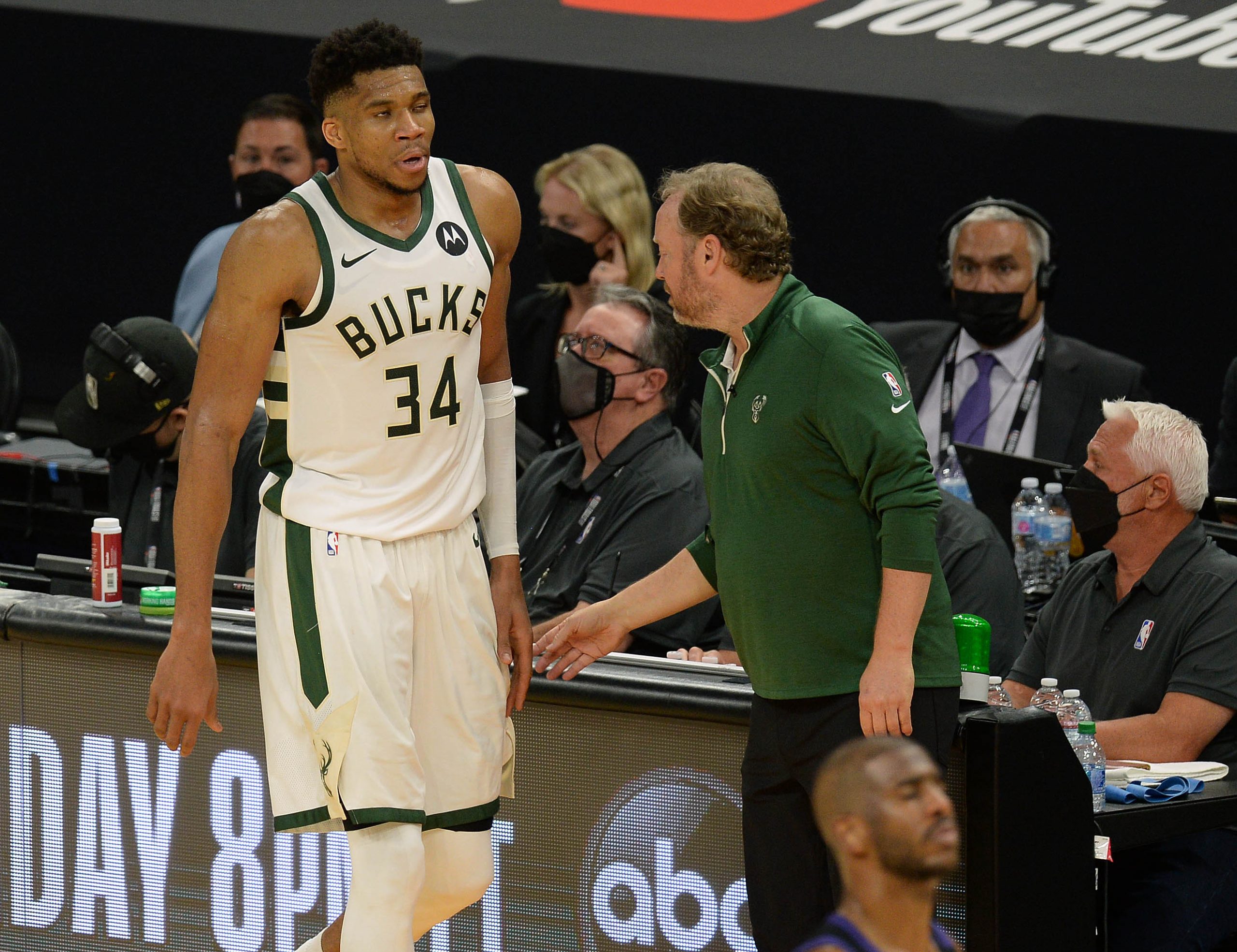 Milwaukee Bucks forward Giannis Antetokounmpo (34) checks out as he is greeted by head coach Mike Budenholzer during the second half in game two of the 2021 NBA Finals at Phoenix Suns Arena