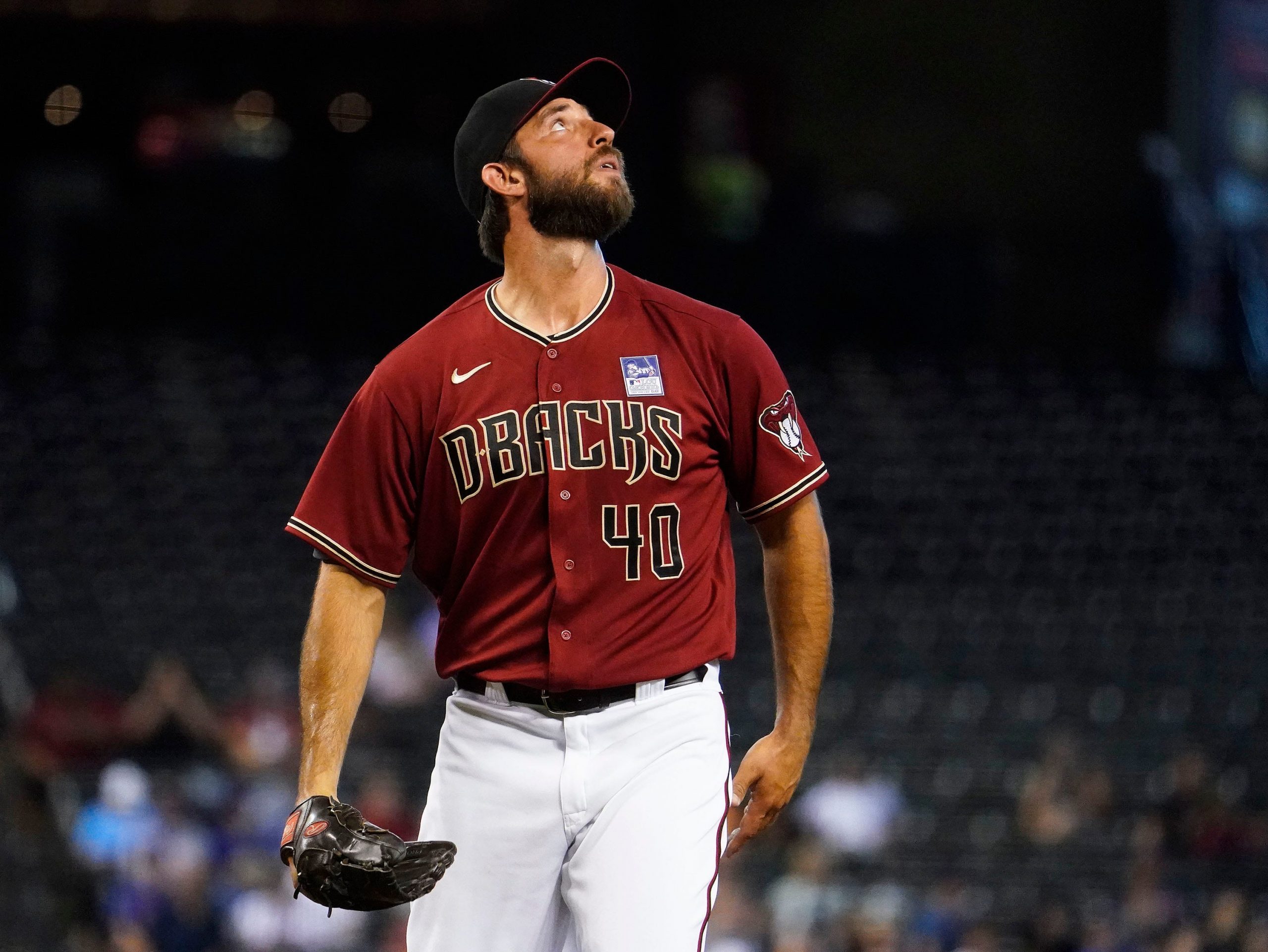 Arizona Diamondbacks starting pitcher Madison Bumgarner (40) watches the ball fly to deep right field for a single off the bat of New York Mets Dominic Smith (2) in the first inning at Chase Field