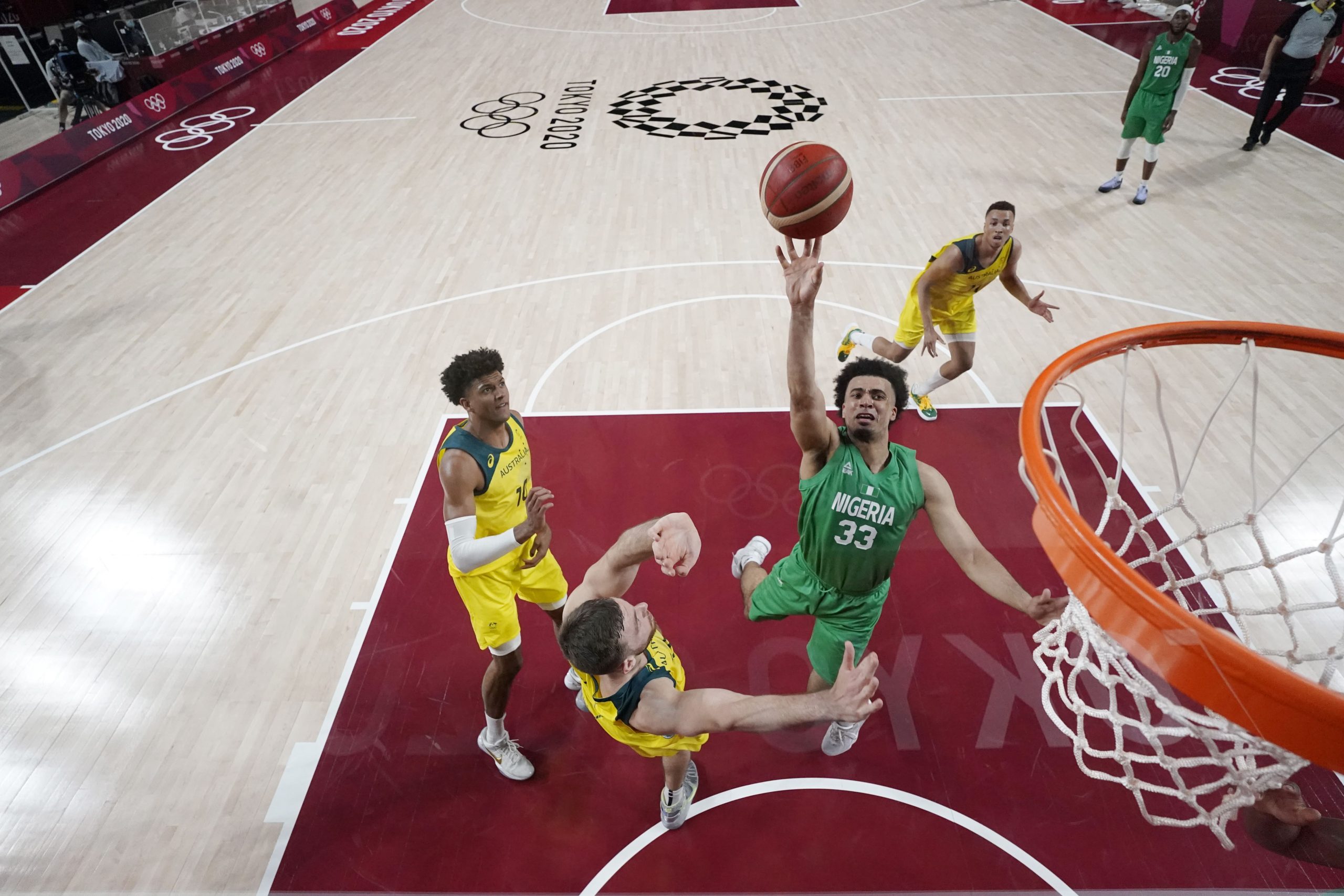 Nigeria player Jordan Nwora (33) shoots while play Australia during the Tokyo 2020 Olympic Summer Games at Saitama Super Arena.