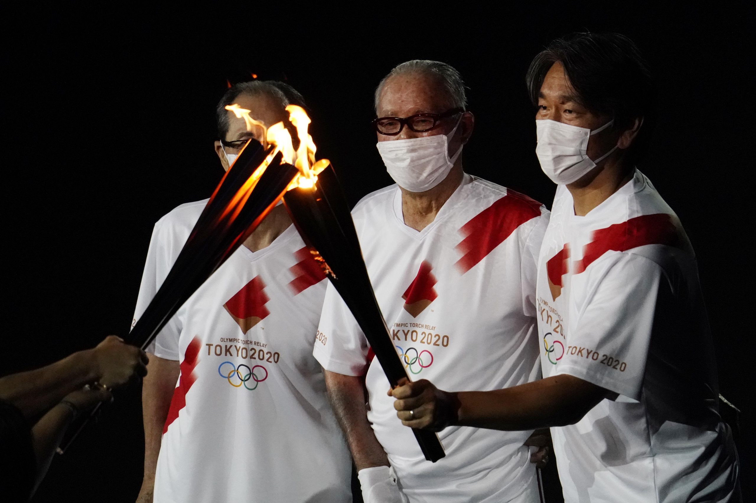 Tokyo, Japan; Baseball players Sadaharu Oh , Shigeo Nagashima and Hideki Matsui with the Olympic flame during the opening ceremony for the Tokyo 2020 Olympic Summer Games at Olympic Stadium Olympic baseball