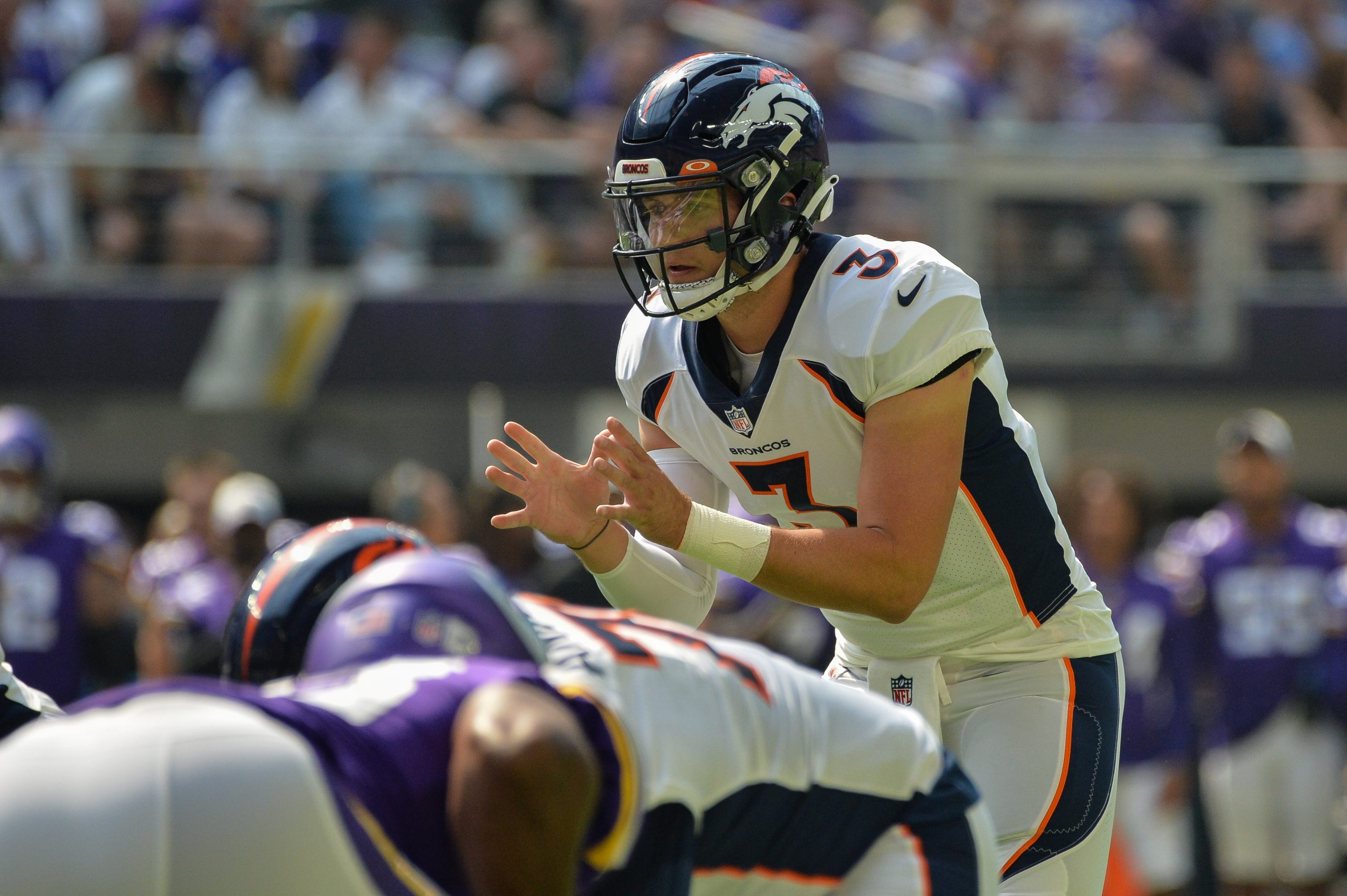 Denver Broncos quarterback Drew Lock (3) controls the offense against the Minnesota Vikings during the first quarter at U.S. Bank Stadium