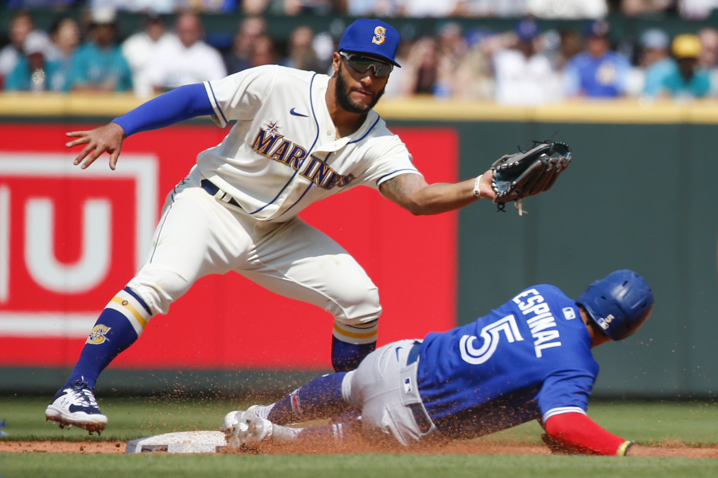 Toronto Blue Jays third baseman Santiago Espinal (5) steals second against Seattle Mariners second baseman Abraham Toro (13) during the fourth inning at T-Mobile Park