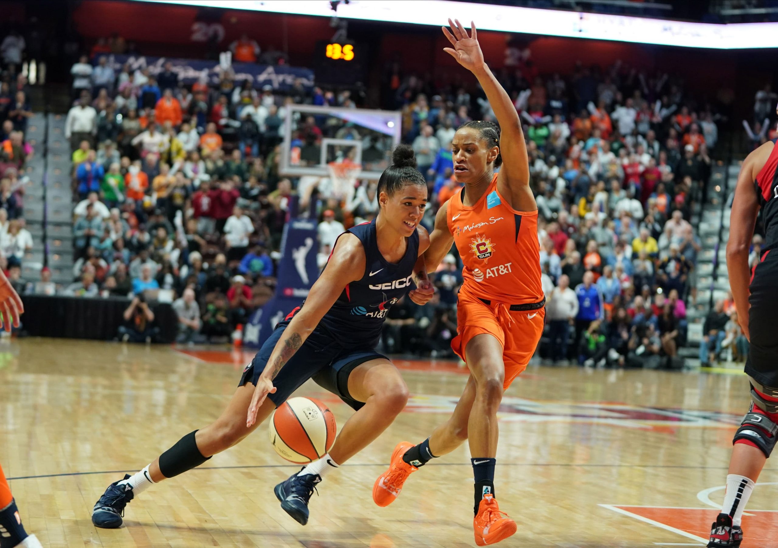 Mystics' Natasha Cloud drives past Sun's Jasmine Thomas