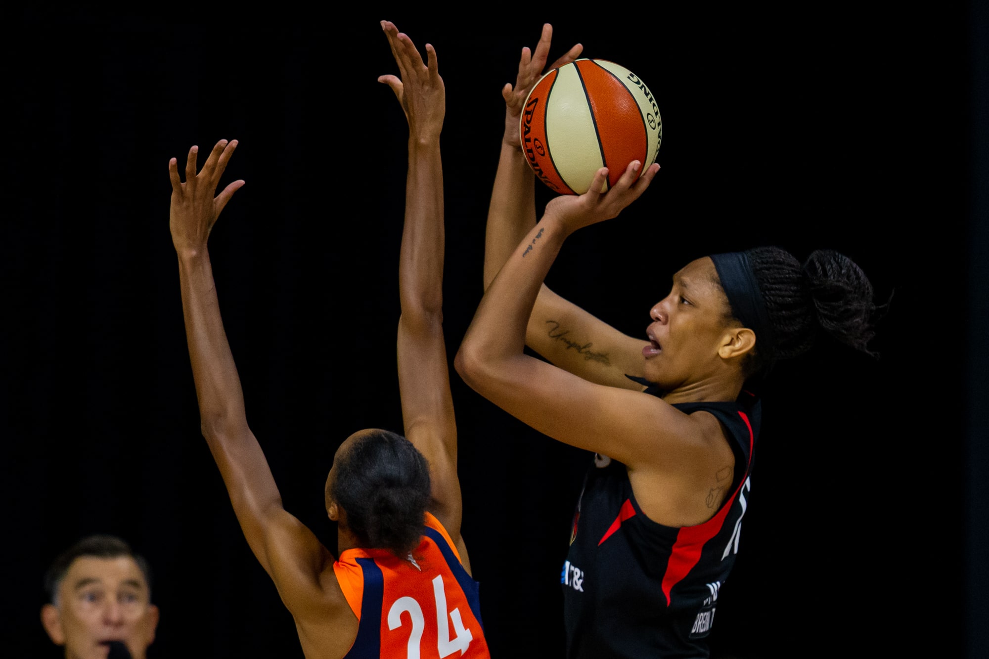 Aces' forward A'ja Wilson shoots over Sun's DeWanna Bonner.