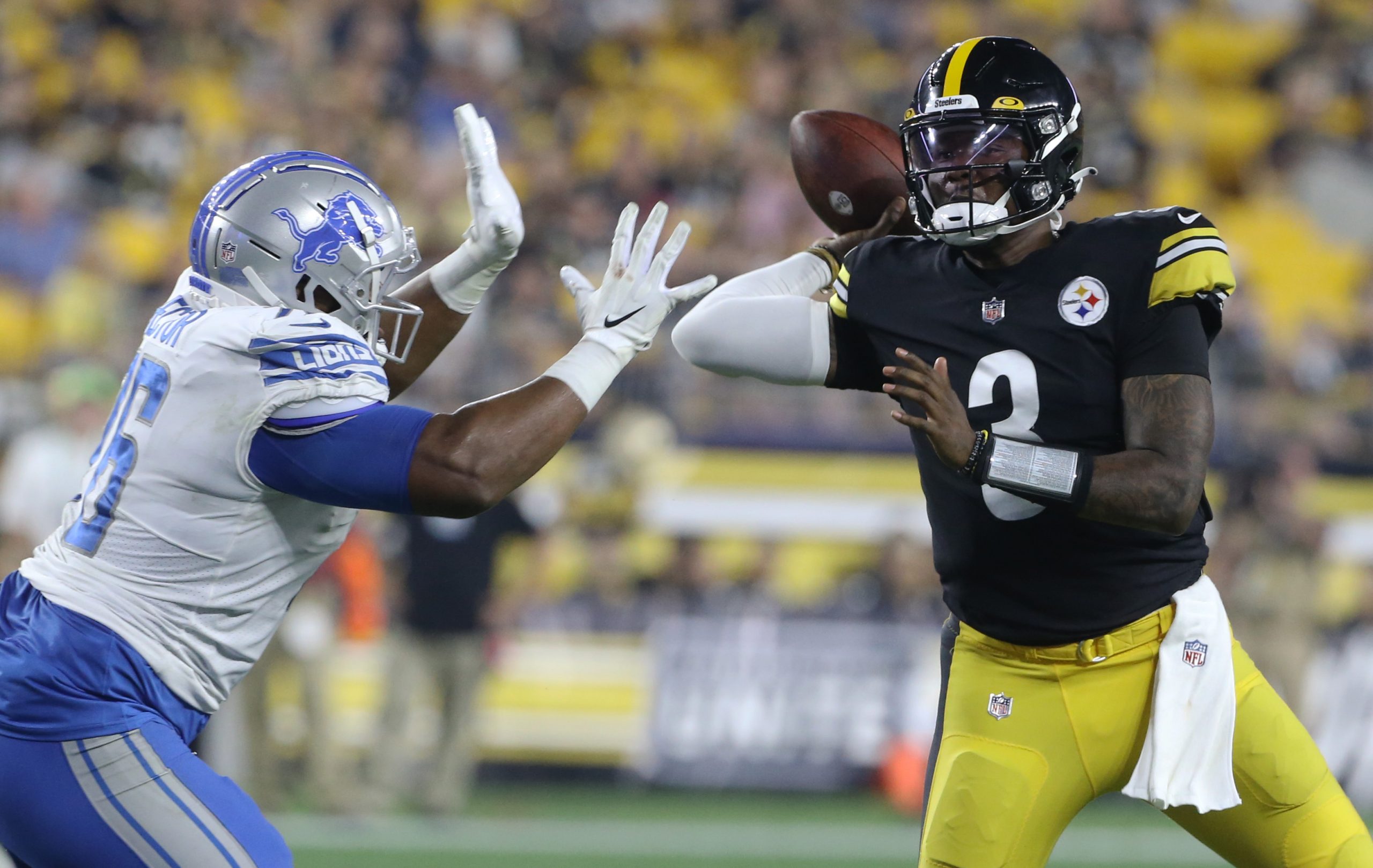 Pittsburgh Steelers quarterback Dwayne Haskins (3) throws the ball under pressure from Detroit Lions defensive tackle Brian Price (76) during the fourth quarter at Heinz Field preseason