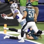 Dallas Cowboys wide receiver CeeDee Lamb (88) runs with the ball for a touchdown in the fourth quarter against Philadelphia Eagles linebacker Alex Singleton (49) at AT&T Stadium.