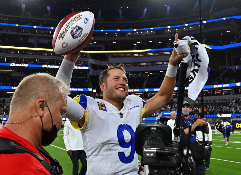 Los Angeles Rams quarterback Matthew Stafford (9) smiles as he leaves the field after defeating the Chicago Bears at SoFi Stadium