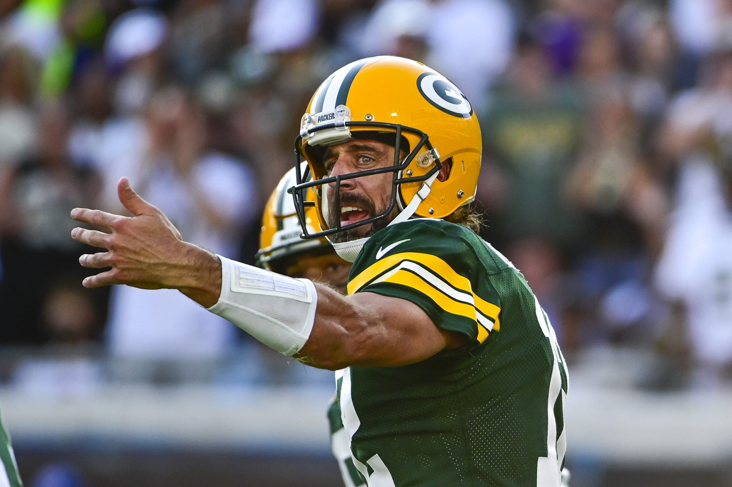 Green Bay Packers quarterback Aaron Rodgers (12) directs teammates during the second half \against the New Orleans Saints at TIAA Bank Field.