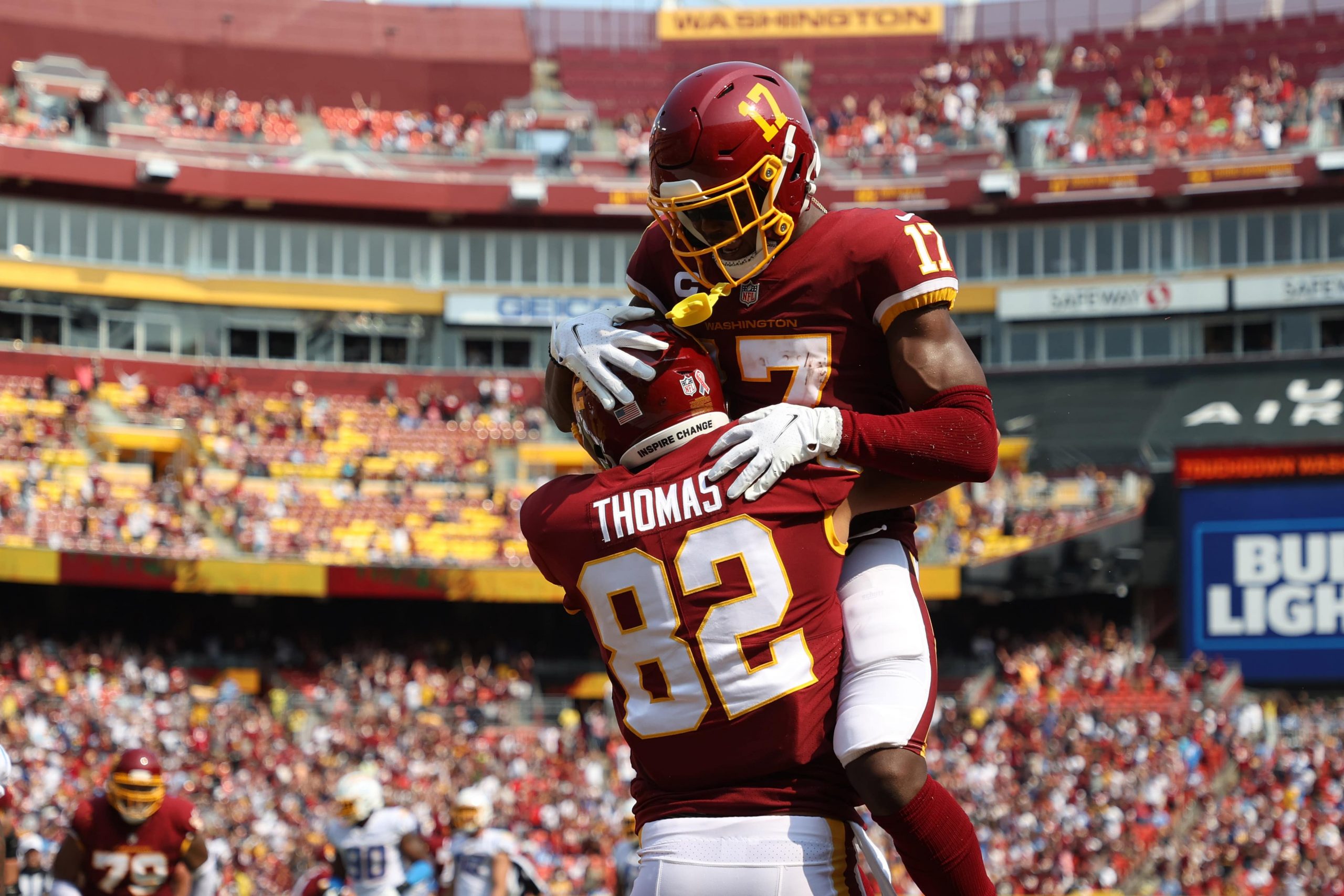 Washington Football Team tight end Logan Thomas (82) celebrates with Washington Football Team wide receiver Terry McLaurin (17) after catching a touchdown pass against the Los Angeles Chargers.