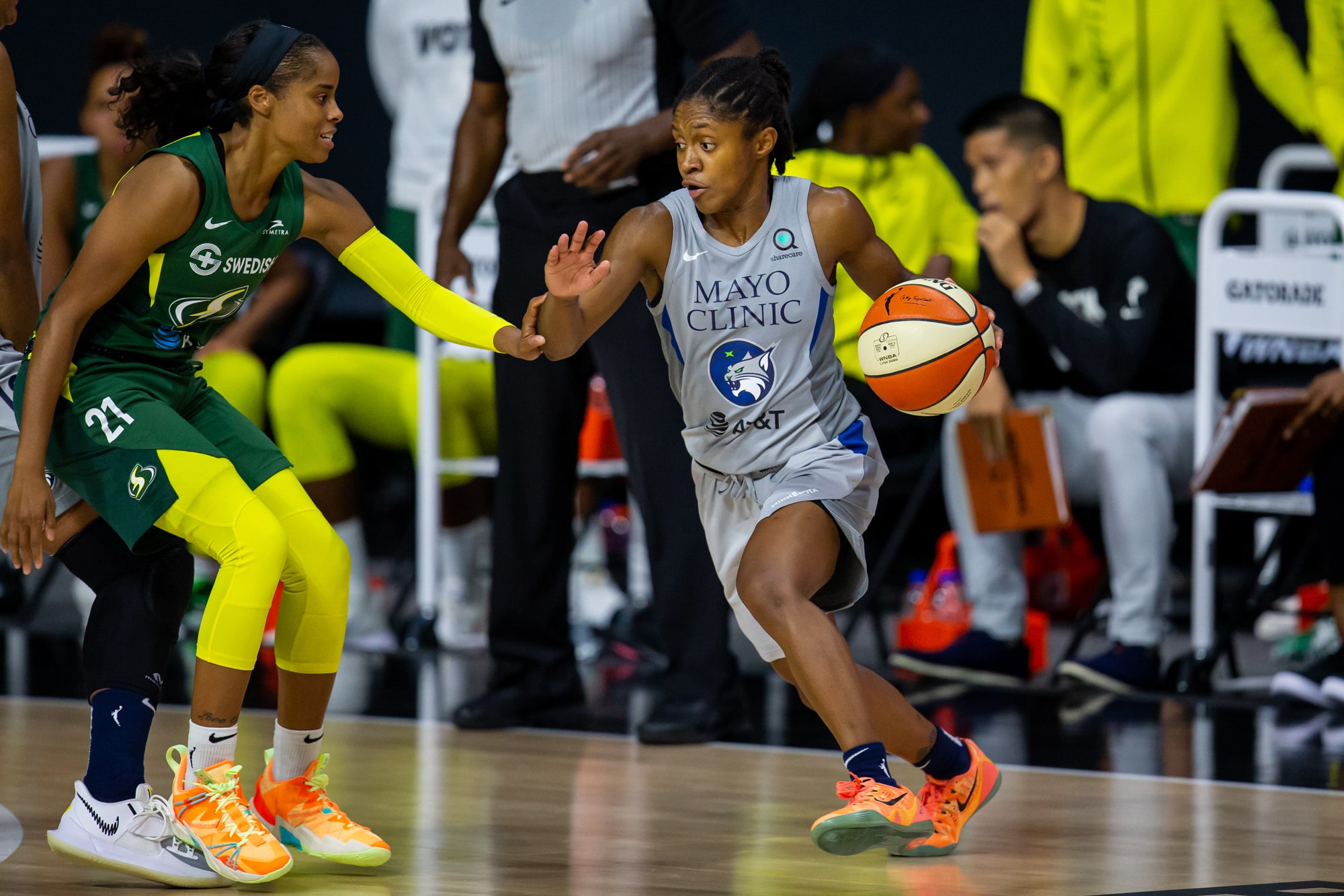 Storm guard Jordin Canada defends Lynx guard Crystal Dangerfield.