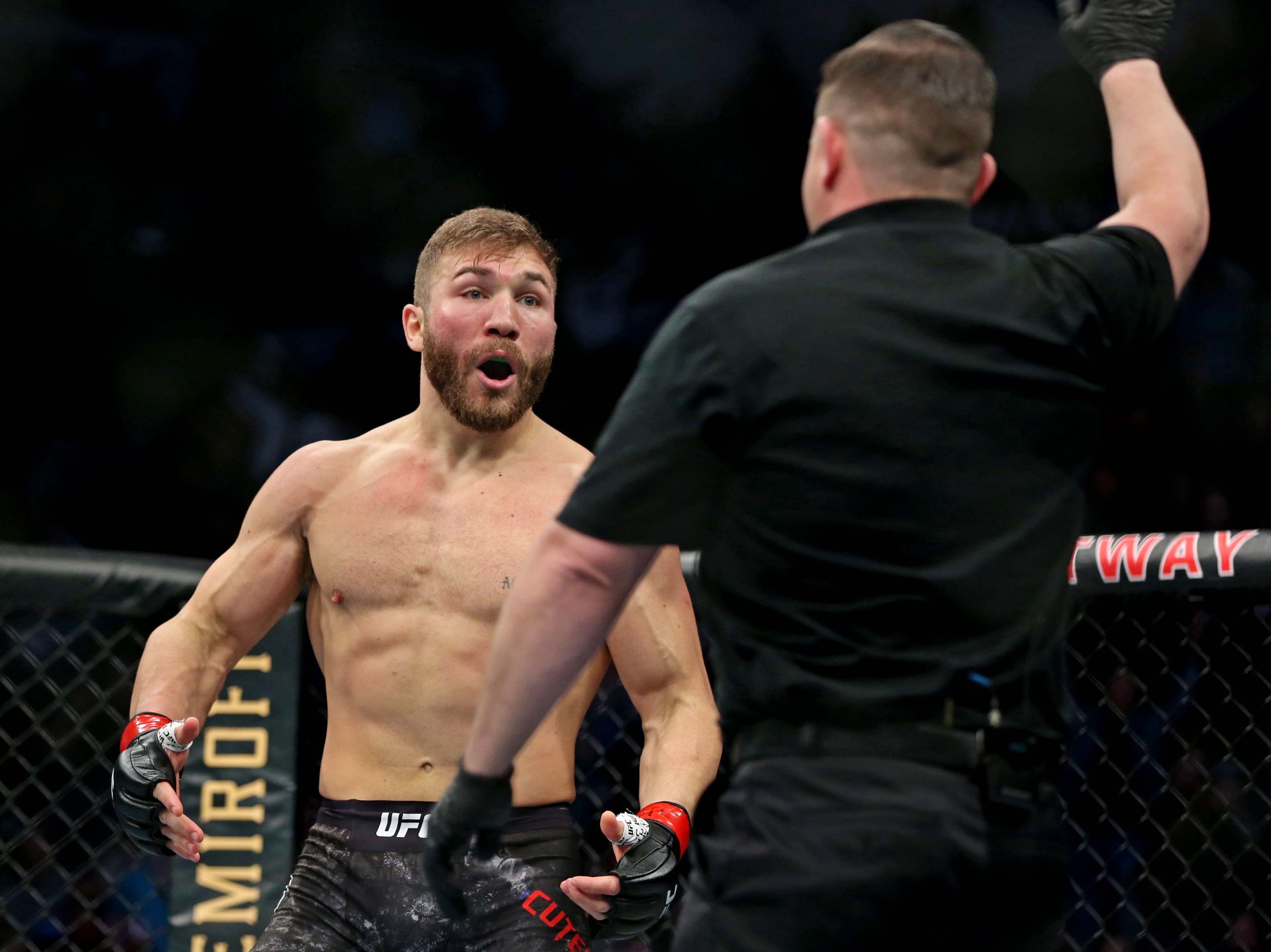 Feb 29, 2020; Norfolk, Virginia, USA; Ion Cutelaba (red gloves) reacts to losing against Magomed Ankalaev (blue gloves) during UFC Fight Night at Chartway Arena.