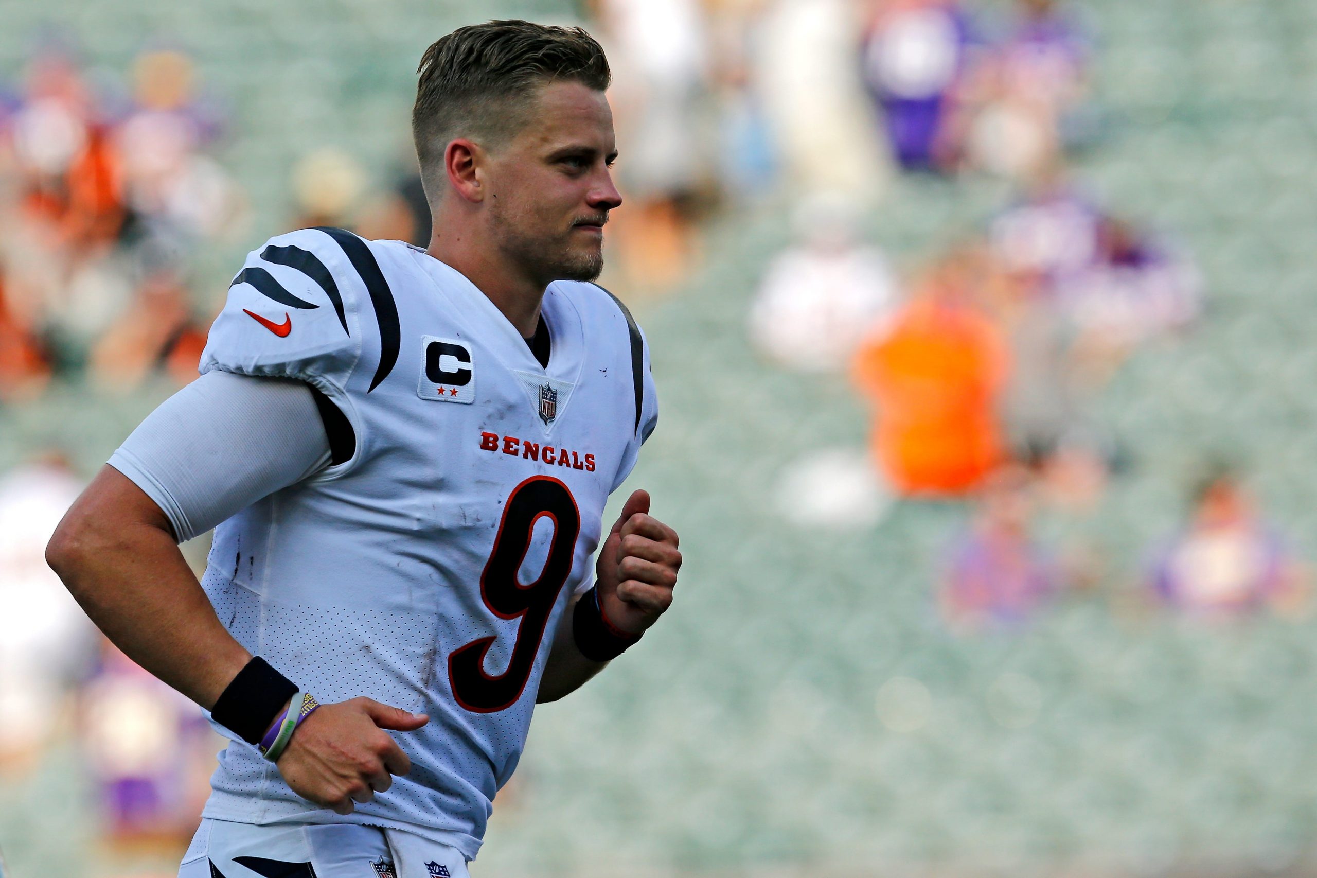 Cincinnati Bengals quarterback Joe Burrow (9) runs for the locker room after overtime of the NFL Week One game between the Cincinnati Bengals and the Minnesota Vikings at Paul Brown Stadium in downtown Cincinnati on Sunday, Sept. 12, 2021. The Bengals won 27-24 on a last minute field goal in overtime parlay