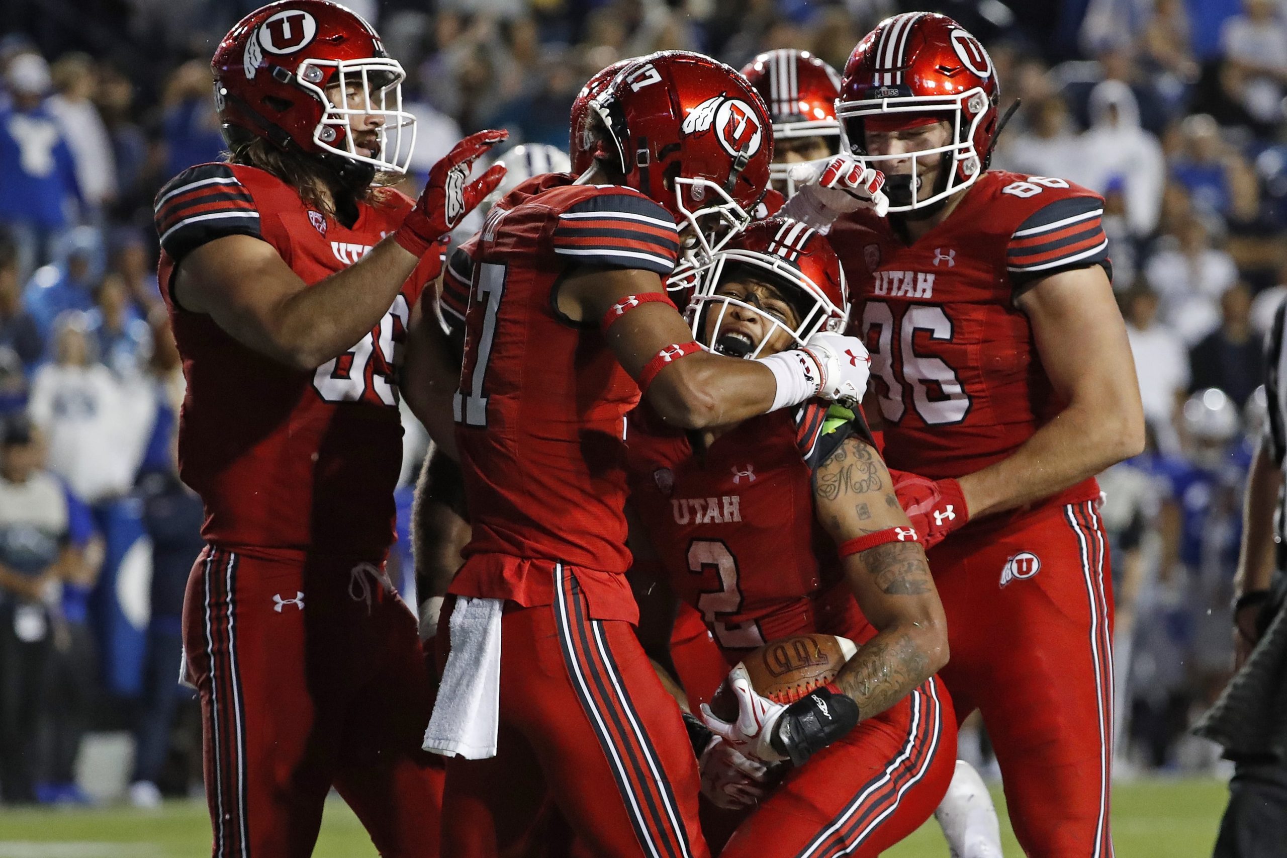 Utah Utes running back Micah Bernard (2) celebrates his fourth quarter touchdown against the Brigham Young Cougars at LaVell Edwards Stadium