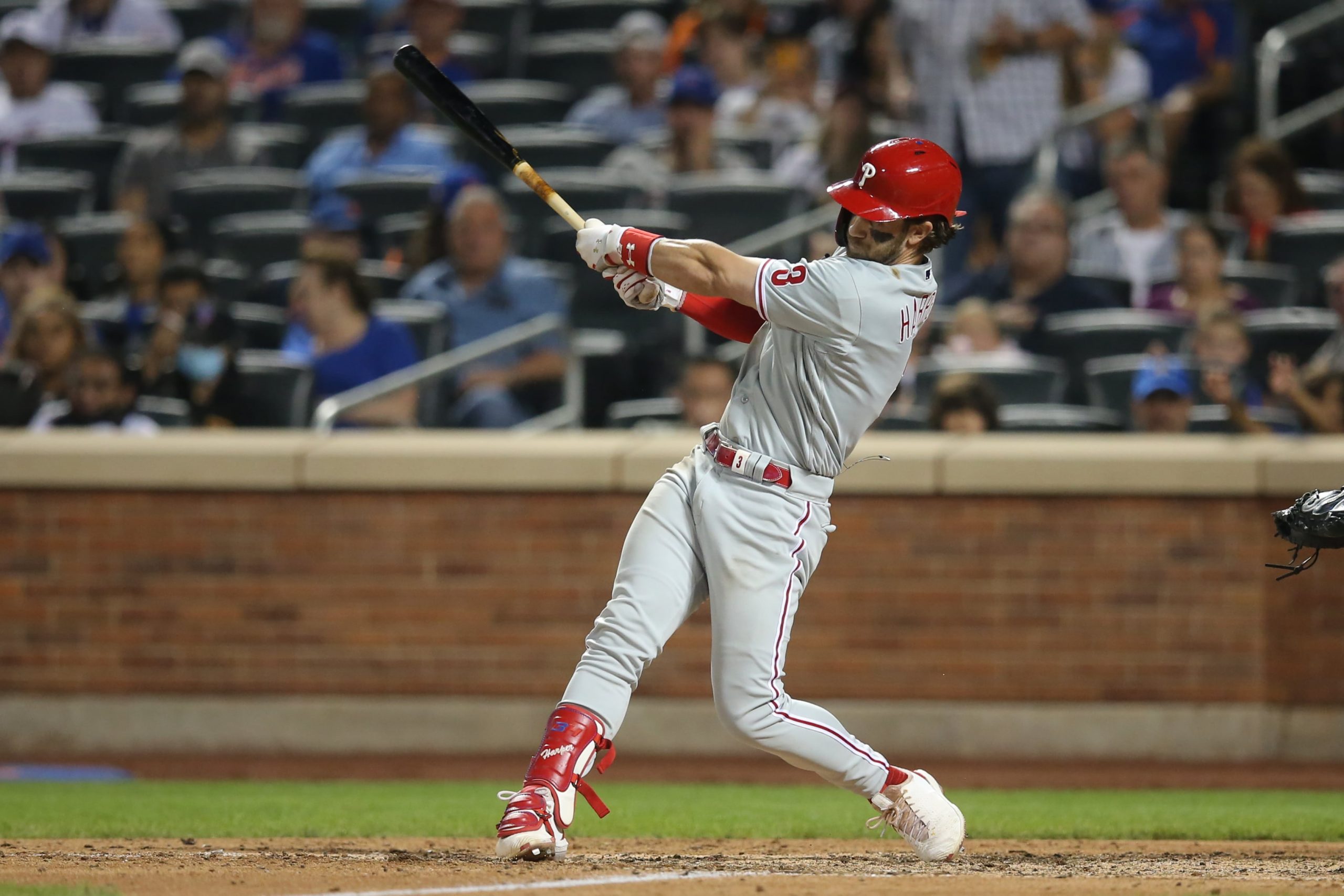 Philadelphia Phillies right fielder Bryce Harper (3) hits a two run double against the New York Mets during the seventh inning at Citi Field. Mandatory Credit: Brad Penner-USA TODAY Sports