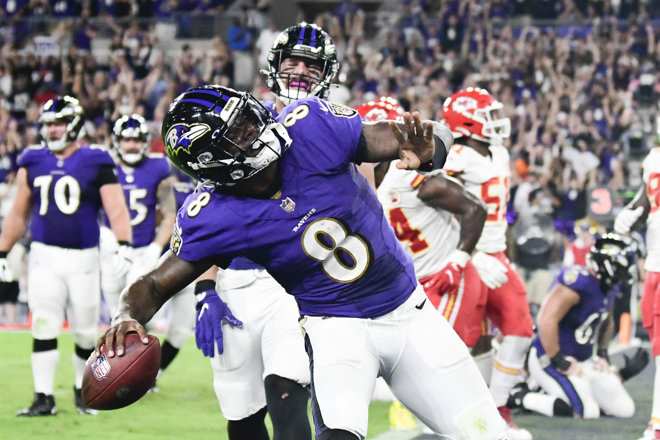 Baltimore Ravens quarterback Lamar Jackson (8) celebrates scoring a fourth quarter touchdown against the Kansas City Chiefs at M&T Bank Stadium