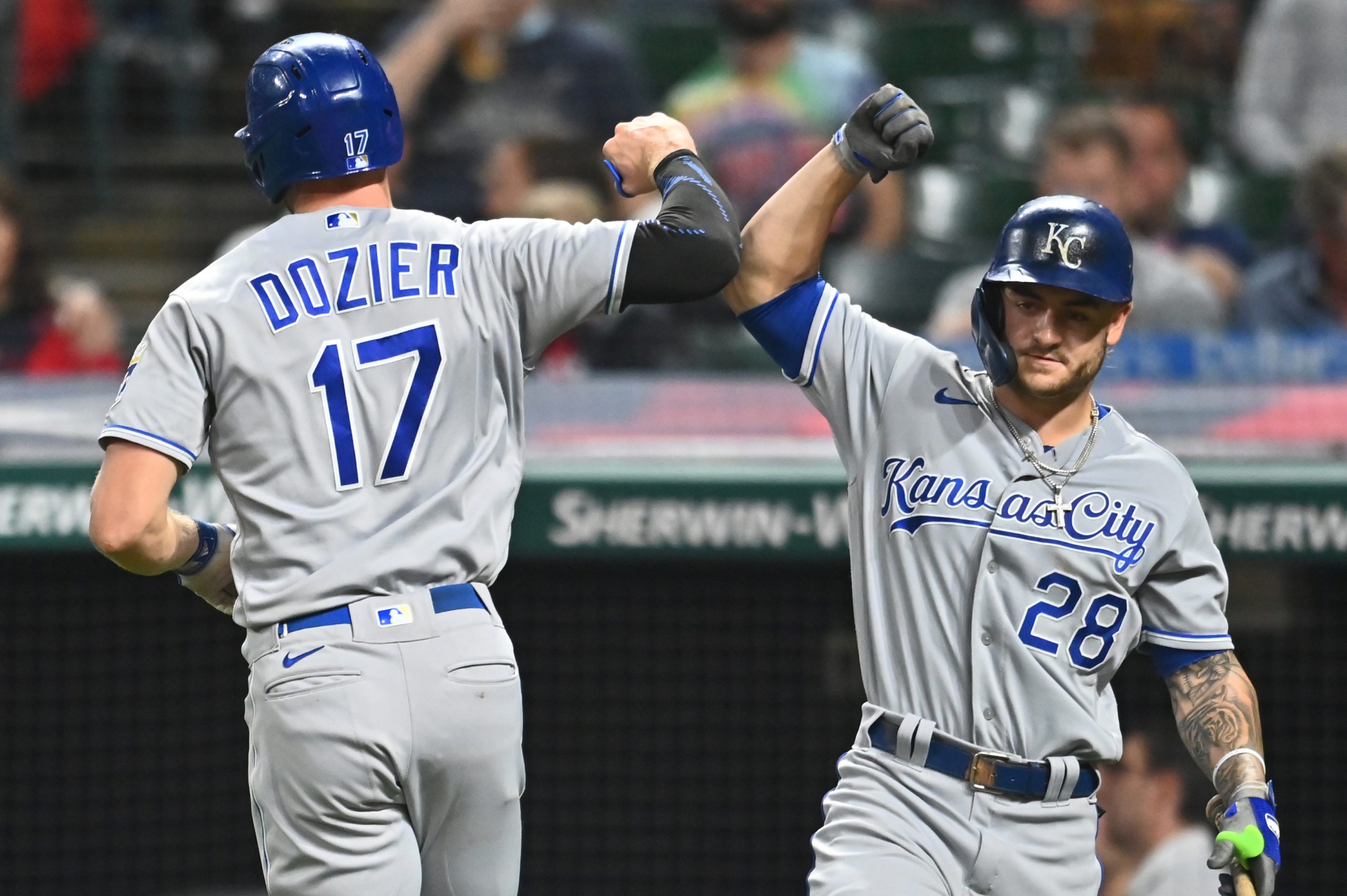 Sep 21, 2021; Cleveland, Ohio, USA; Kansas City Royals designated hitter Hunter Dozier (17) celebrates with center fielder Michael A. Taylor (2) after hitting a home run during the seventh inning at Progressive Field.
