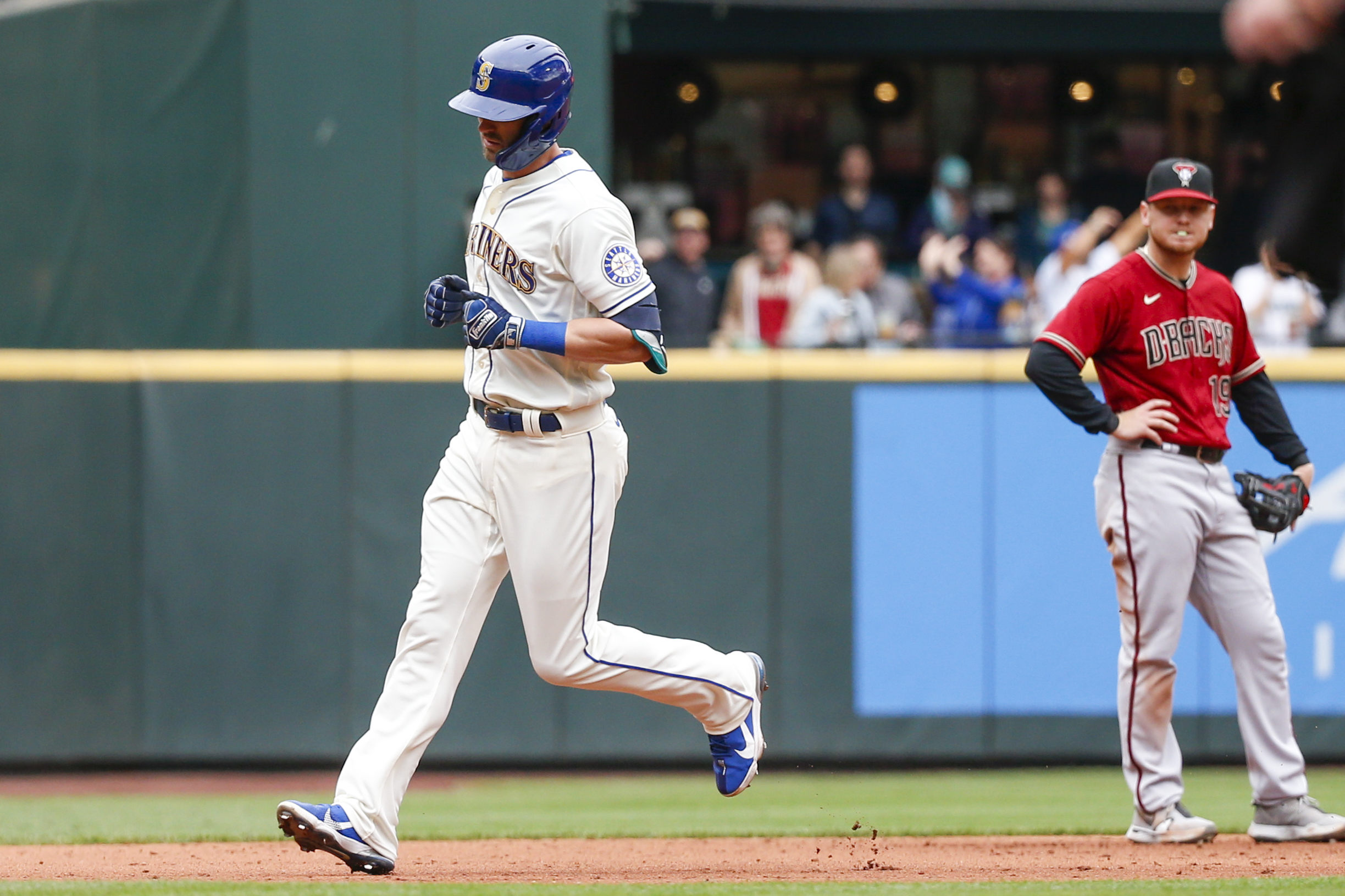 Sep 12, 2021; Seattle, Washington, USA; Seattle Mariners right fielder Mitch Haniger (17) runs the bases after hitting a solo-home run against the Arizona Diamondbacks during the fourth inning at T-Mobile Park.