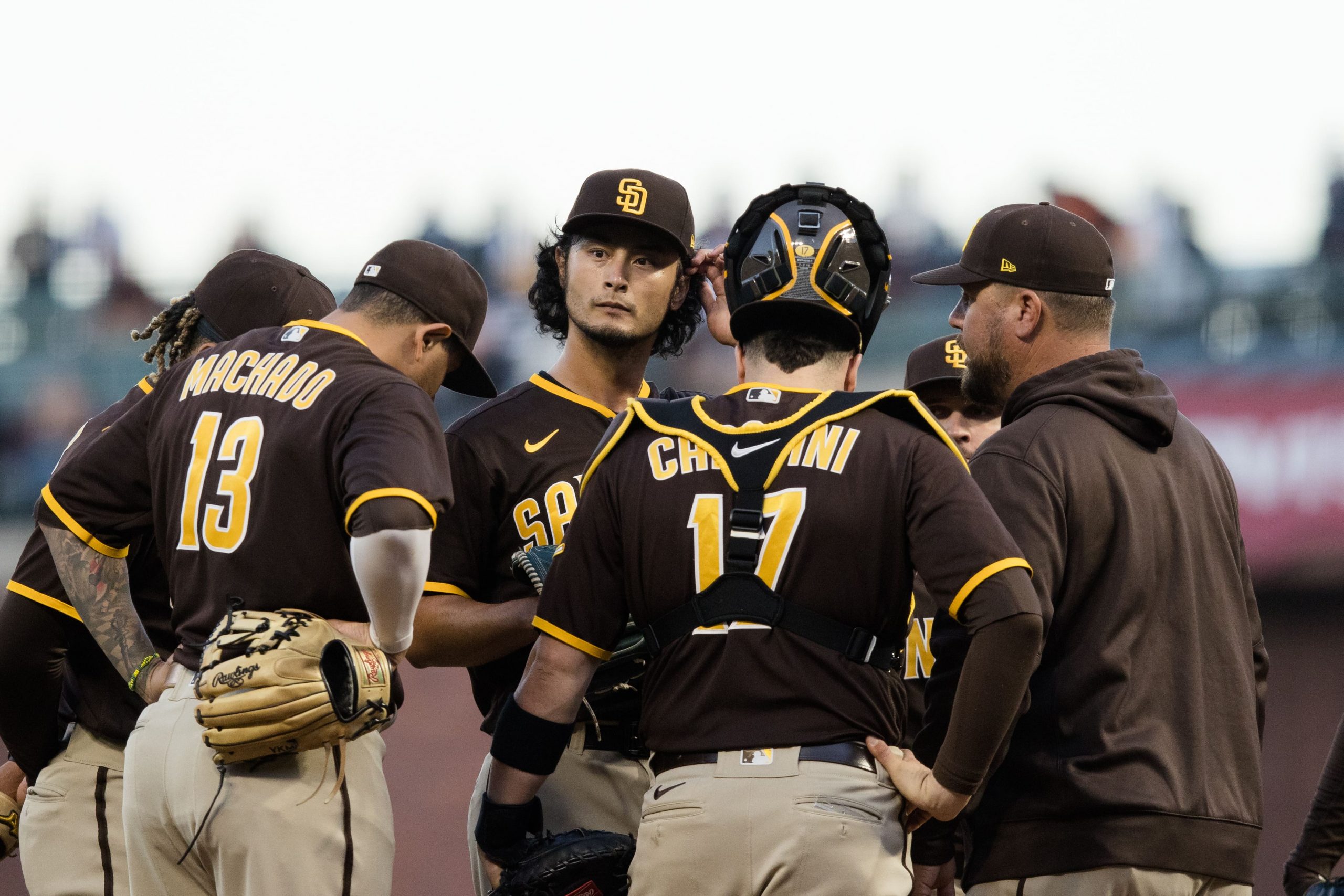 San Diego Padres interim pitching coach Ben Fritz (53) talks to starting pitcher Yu Darvish (11) after he allows two runs by the San Francisco Giants in the first inning at at Oracle Park. Mandatory Credit: John Hefti-USA TODAY Sports