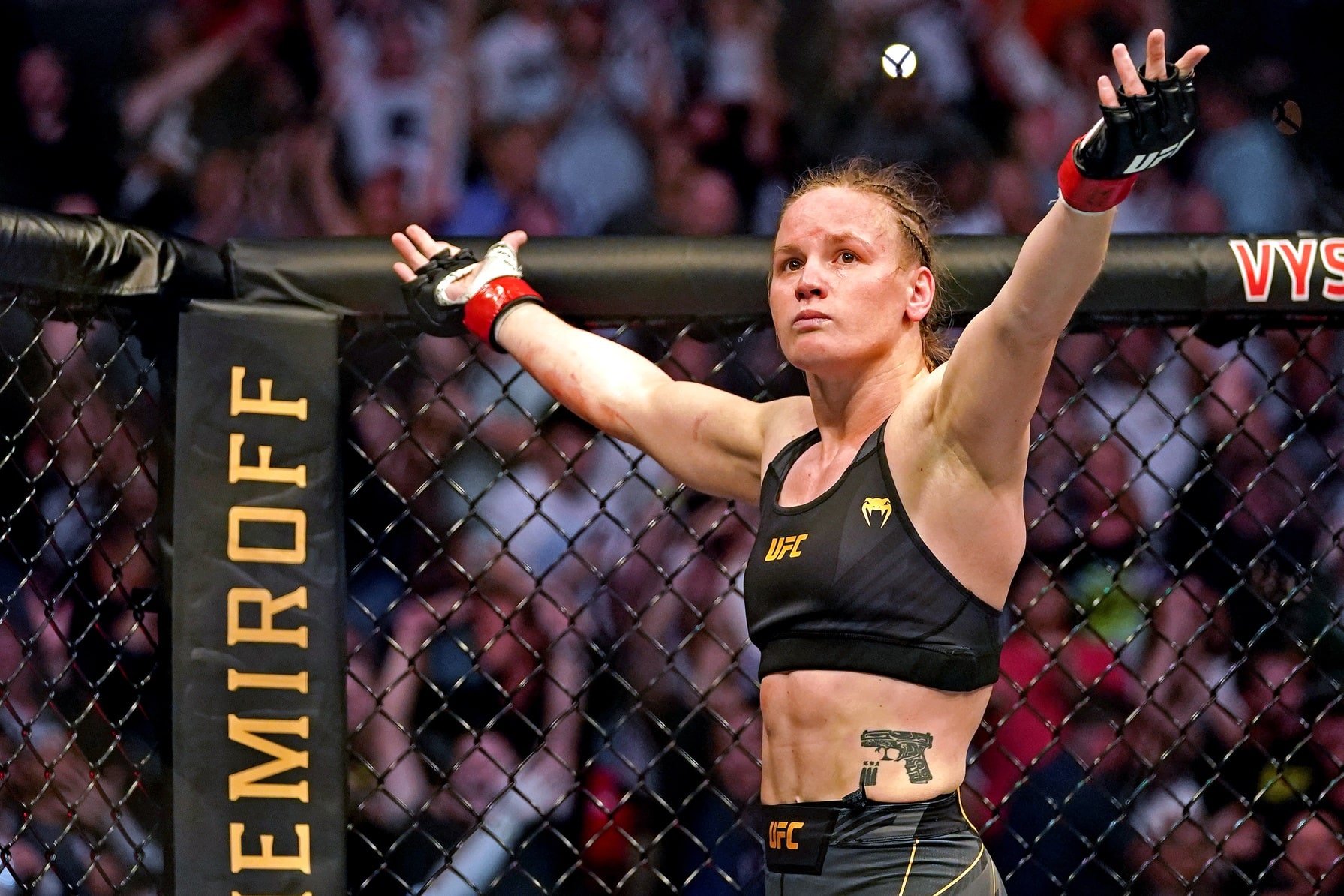 Valentina Shevchenko (Red Gloves) fights Jessica Andrade (Blue Gloves) during UFC 261 at VyStar Veterans Memorial Arena.