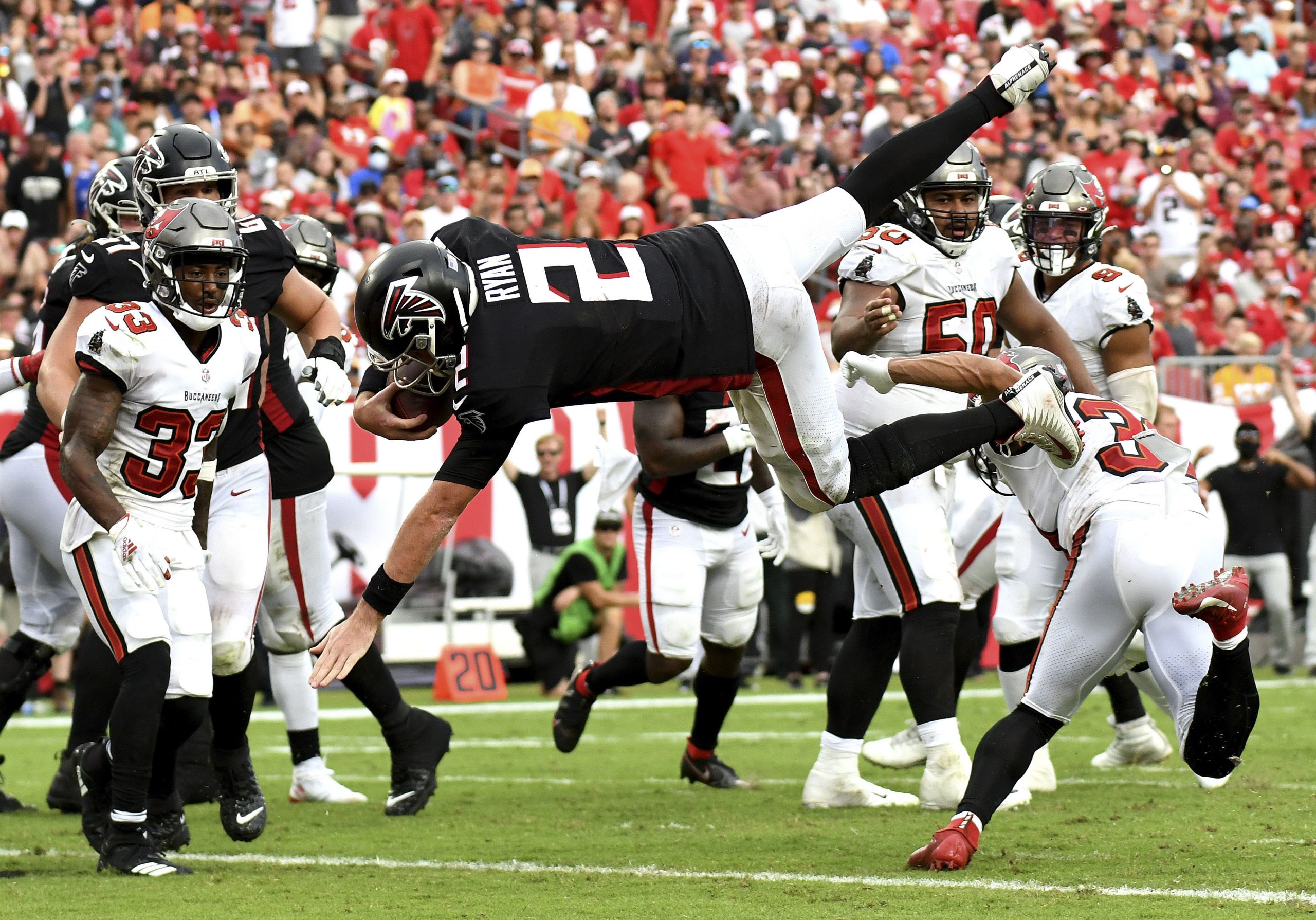 Sep 19, 2021; Tampa, Florida, USA; Atlanta Falcons quarterback Matt Ryan (2) leaps to score a two point conversion in the second half against the Tampa Bay Buccaneers at Raymond James Stadium.