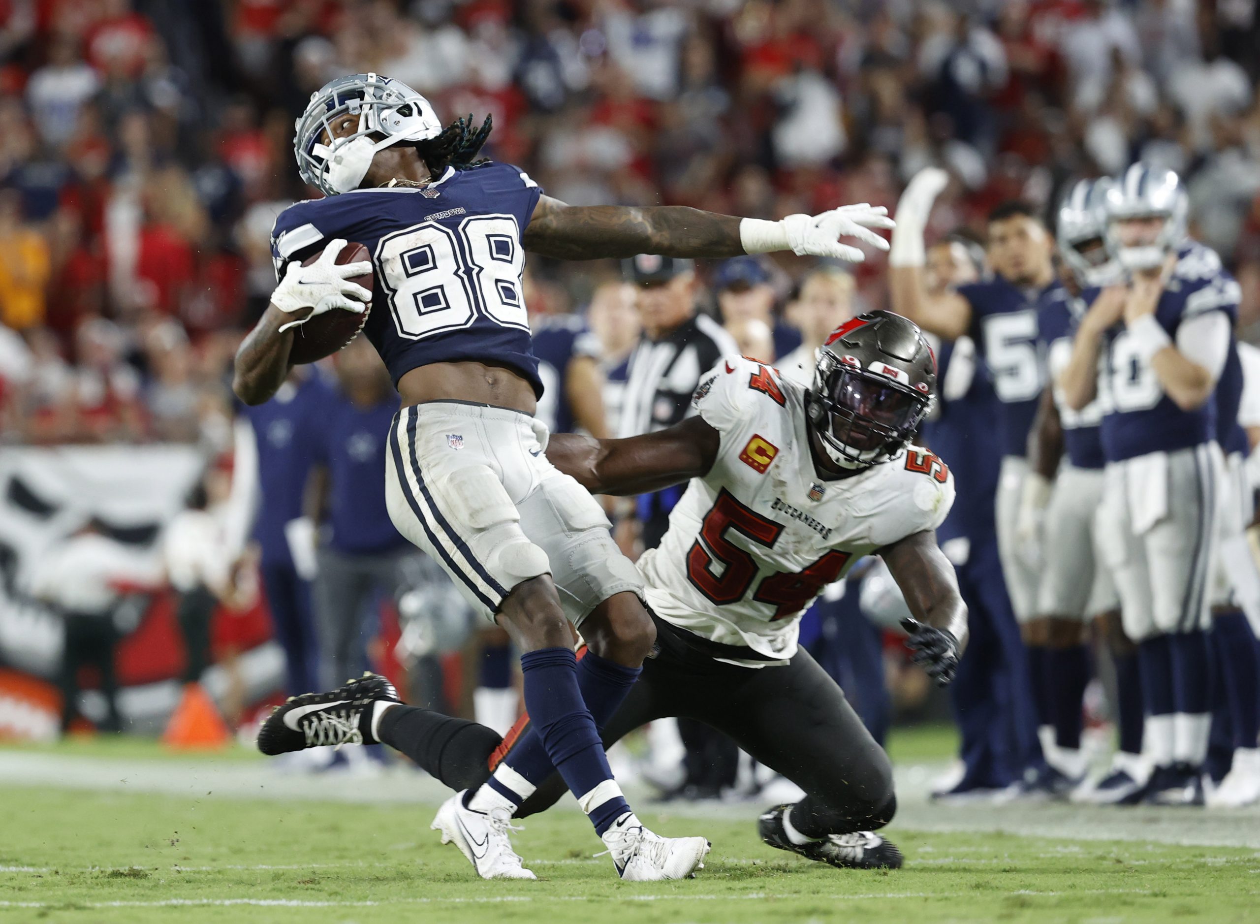Sep 9, 2021; Tampa, Florida, USA; Dallas Cowboys wide receiver CeeDee Lamb (88) runs the ball against Tampa Bay Buccaneers outside linebacker Lavonte David (54) during the second half at Raymond James Stadium.