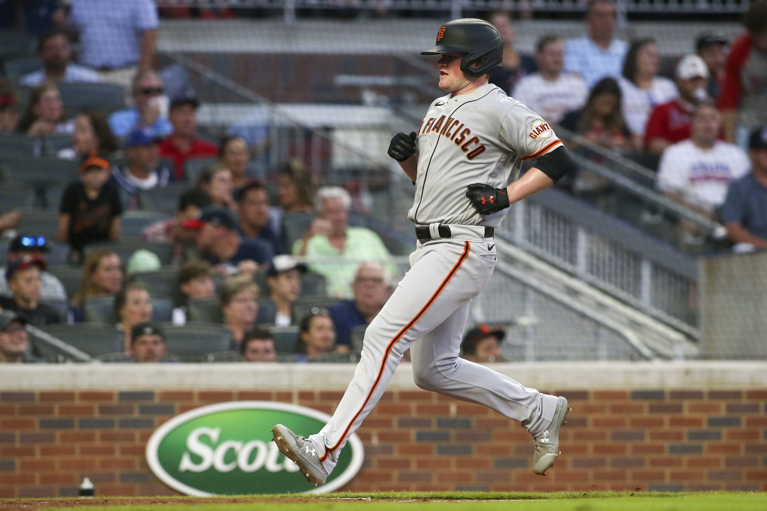Aug 28, 2021; Atlanta, Georgia, USA; San Francisco Giants starting pitcher Logan Webb (62) scores a run against the Atlanta Braves in the third inning at Truist Park.