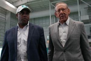 Miami Dolphins general manager Chris Grier (L) and owner Stephan M. Ross (R) walk on the indoor field during the grand opening at Baptist Health Training Complex.
