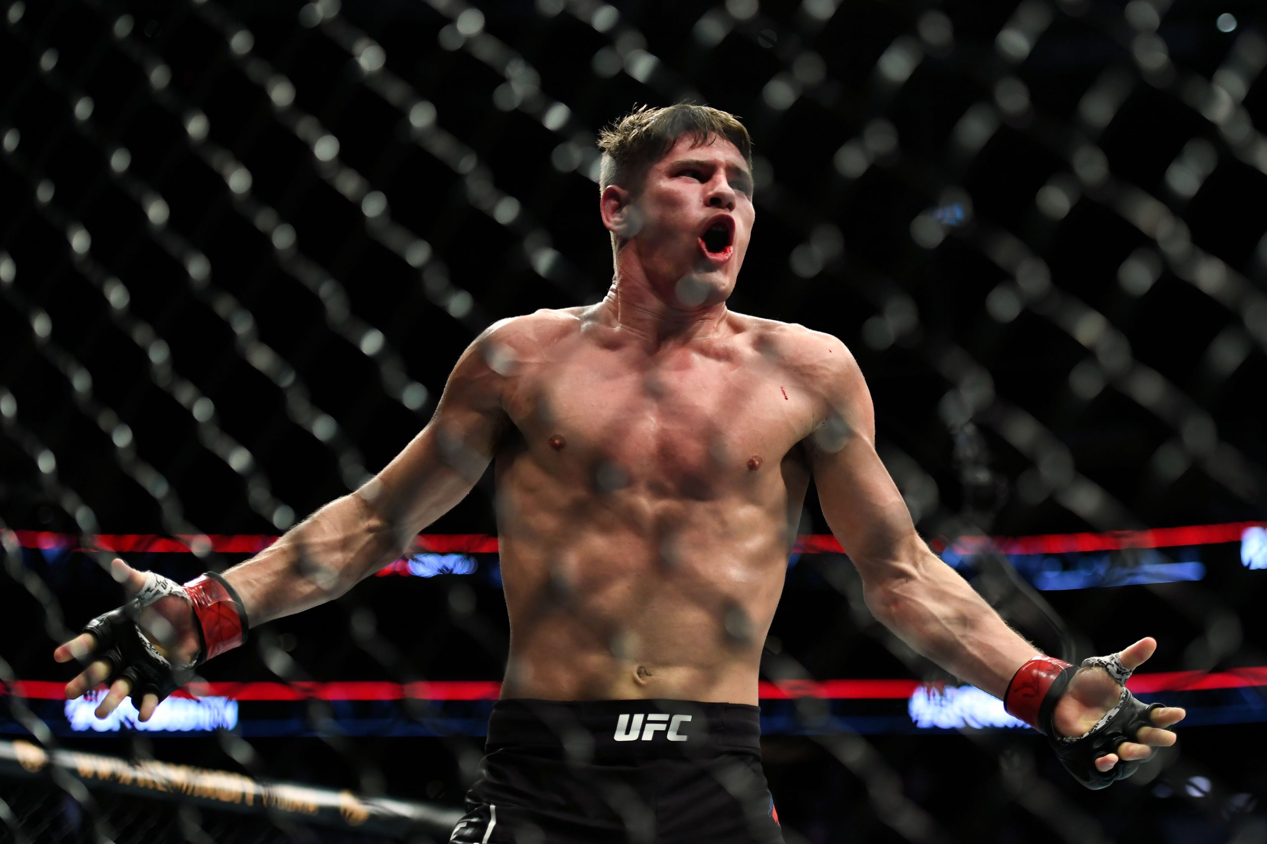 Oct 18, 2019; Boston, MA, USA; Charles Rosa (red) reacts after defeating Manny Bermudez (blue) in a featherweight bout during UFC Fight Night at the TD Garden.