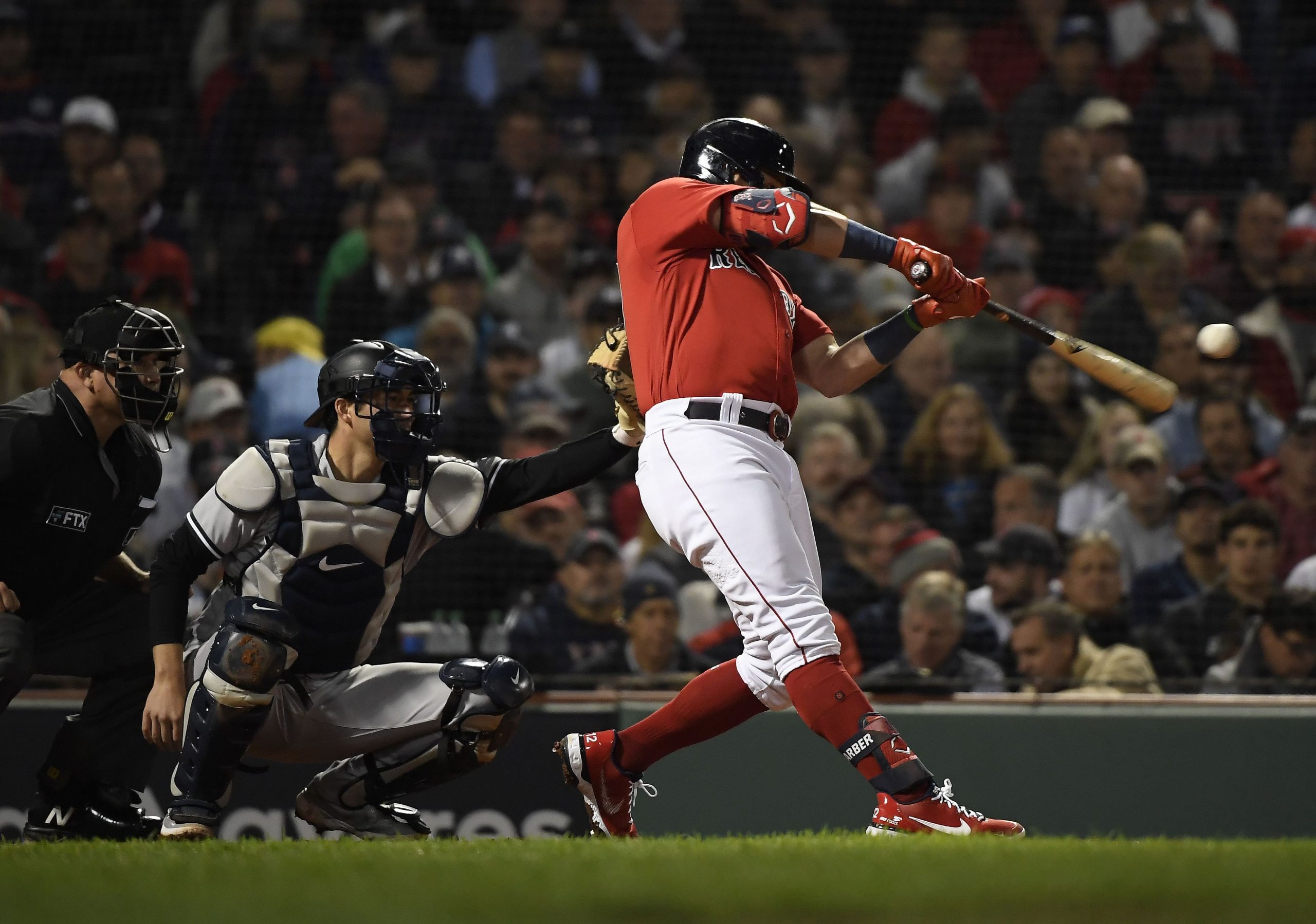 Boston Red Sox designated hitter Kyle Schwarber (18) hits a solo home run against the New York Yankees during the third inning of the American League Wildcard game at Fenway Park. Mandatory Credit: Bob DeChiara-USA TODAY Sports