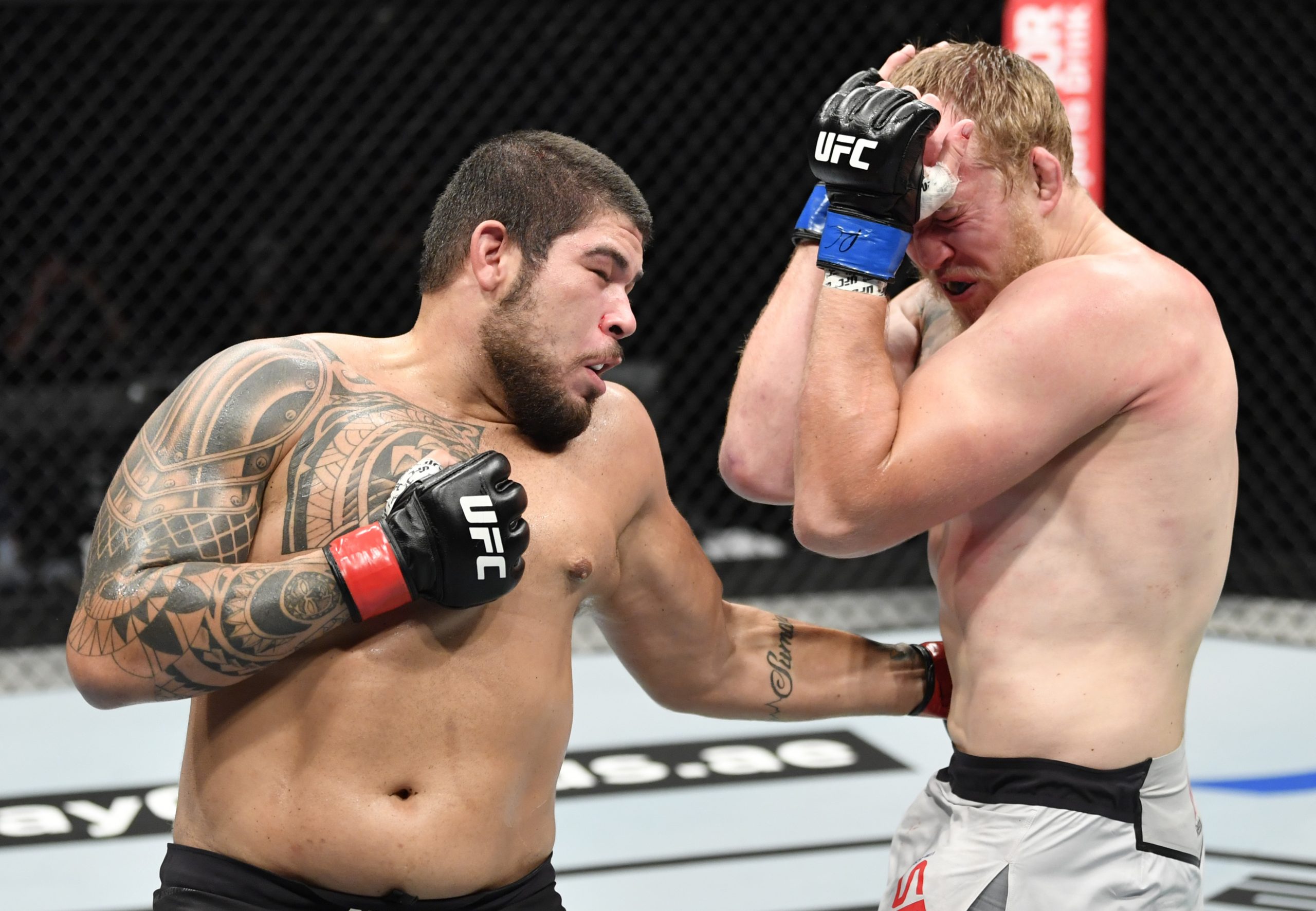 July 19, 2020; Abu Dhabi, UAE; Carlos Felipe of Brazil punches Serghei Spivac of Ukraine in their heavyweight bout during UFC Fight Night at the Flash Forum on UFC Fight Island.