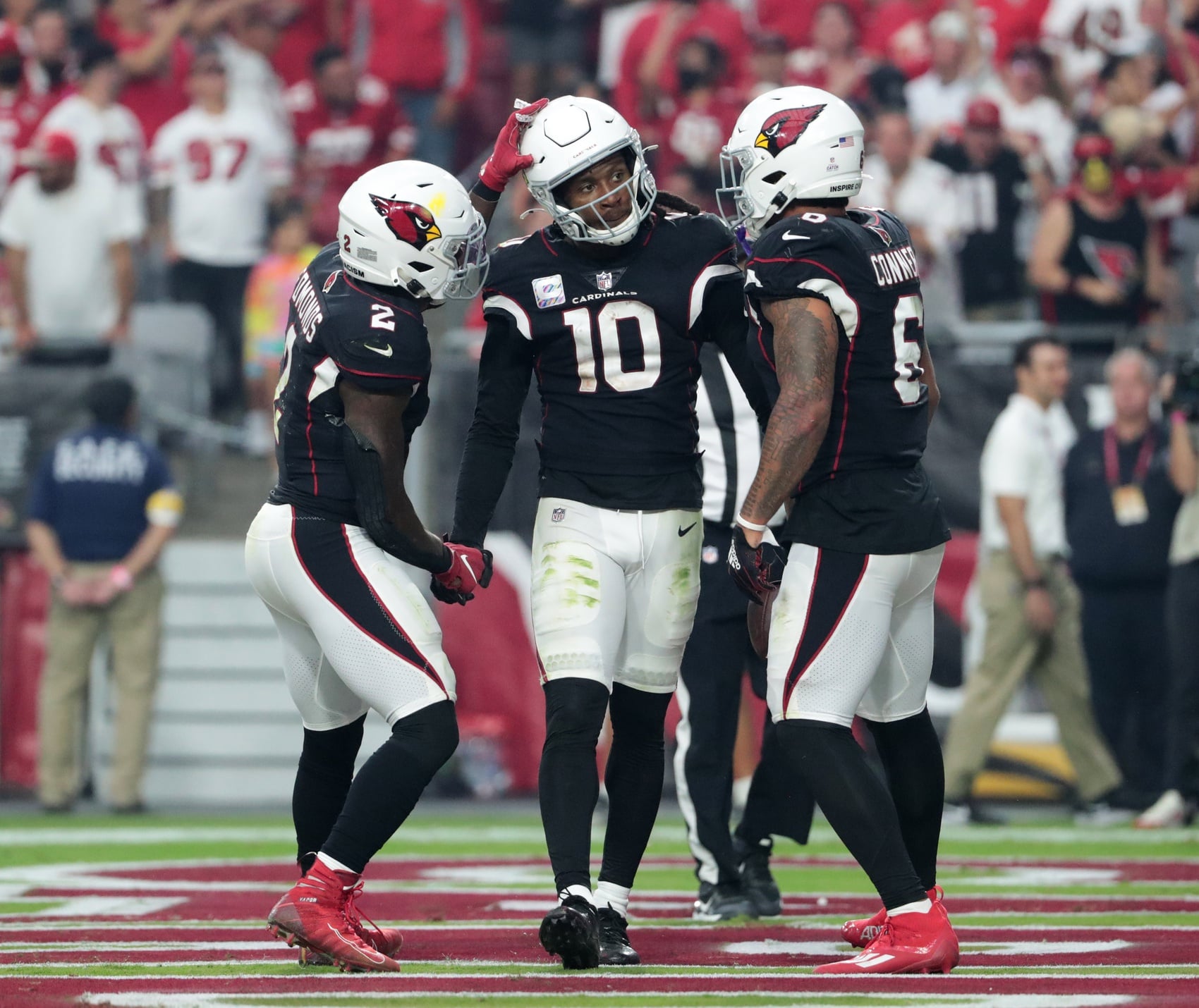 Arizona Cardinals wide receiver DeAndre Hopkins (10) is congratulated by running backs Chase Edmonds (2) and James Conner (6) after a touchdown catch against the San Francisco 49ers.
