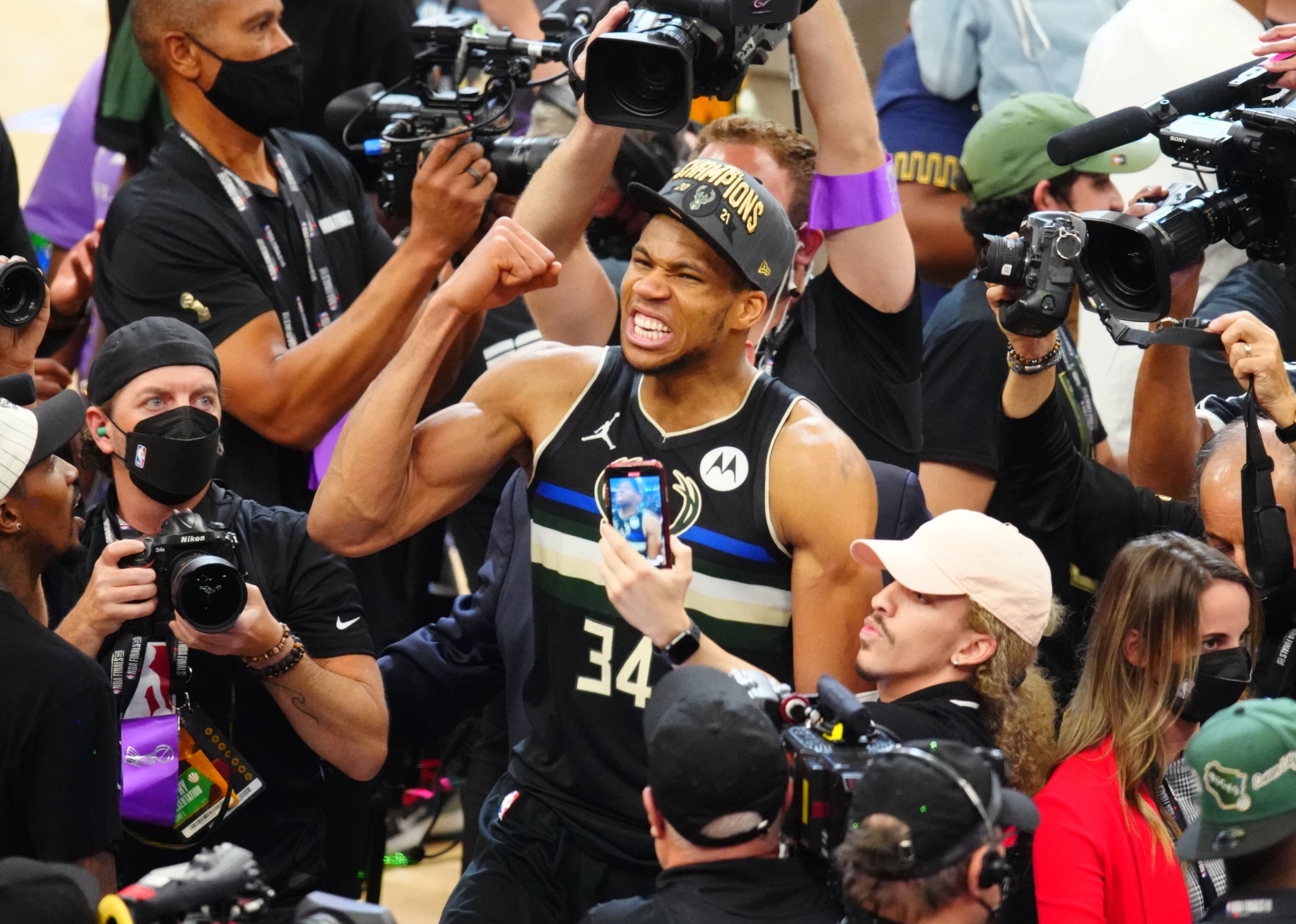 Milwaukee Bucks forward Giannis Antetokounmpo (34) celebrates after winning game six of the 2021 NBA Finals and the championship against the Phoenix Suns at Fiserv Forum.