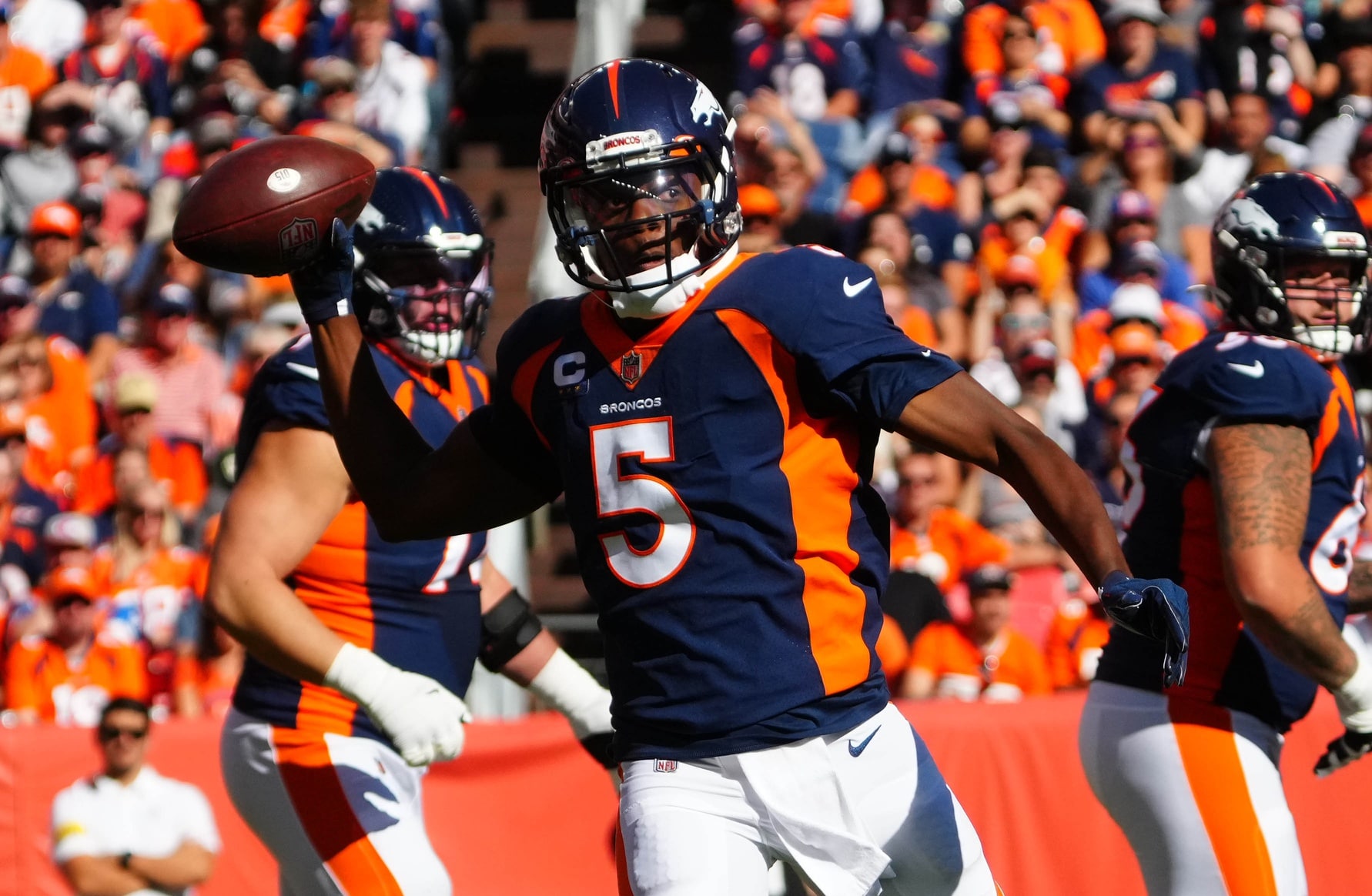 Denver Broncos quarterback Teddy Bridgewater (5) prepares to pass the ball in the first quarter against the Las Vegas Raiders at Empower Field at Mile High.