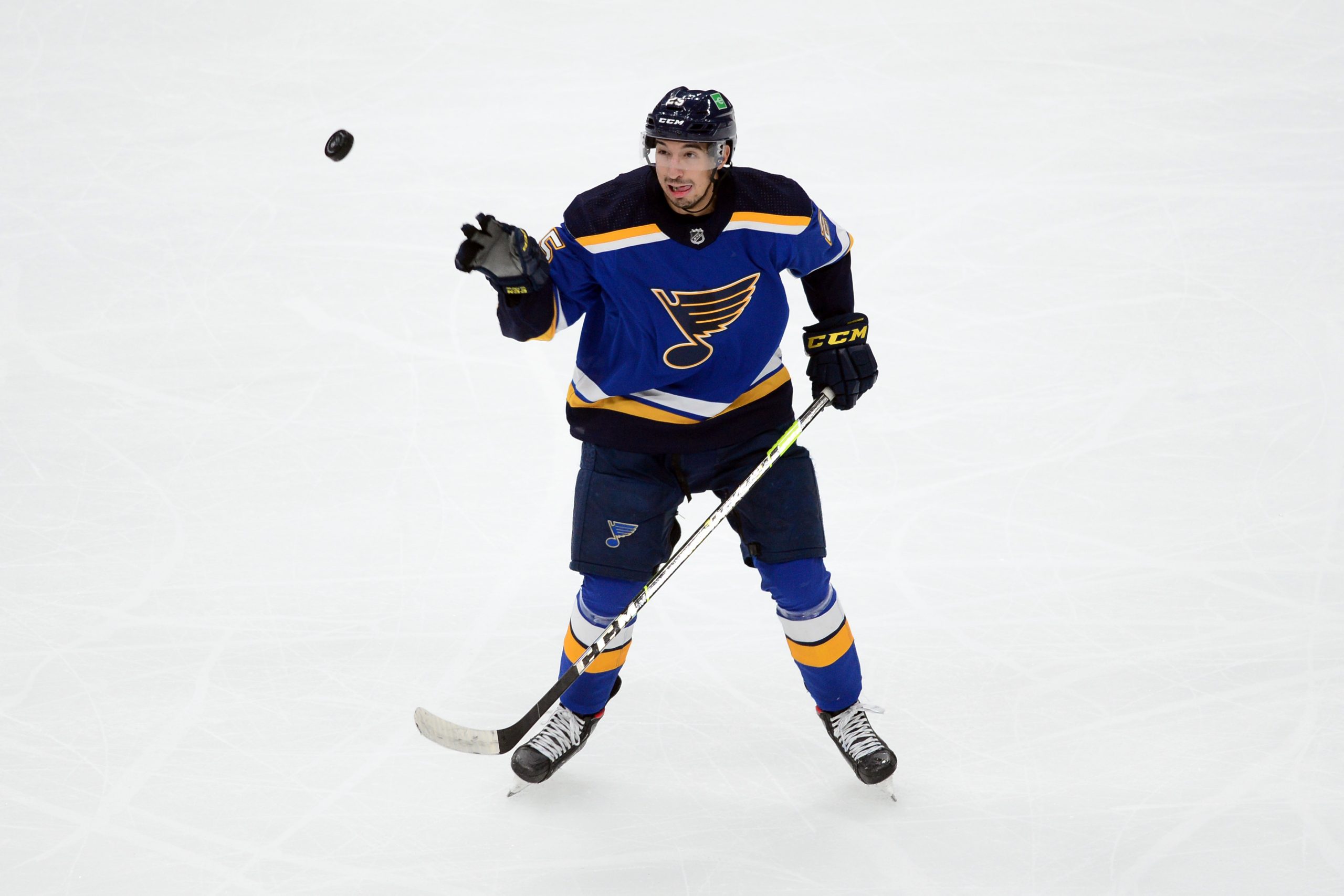 Oct 18, 2021; Glendale, Arizona, USA; St. Louis Blues center Jordan Kyrou (25) attempts to control the puck against the Arizona Coyotes during the third period at Gila River Arena.